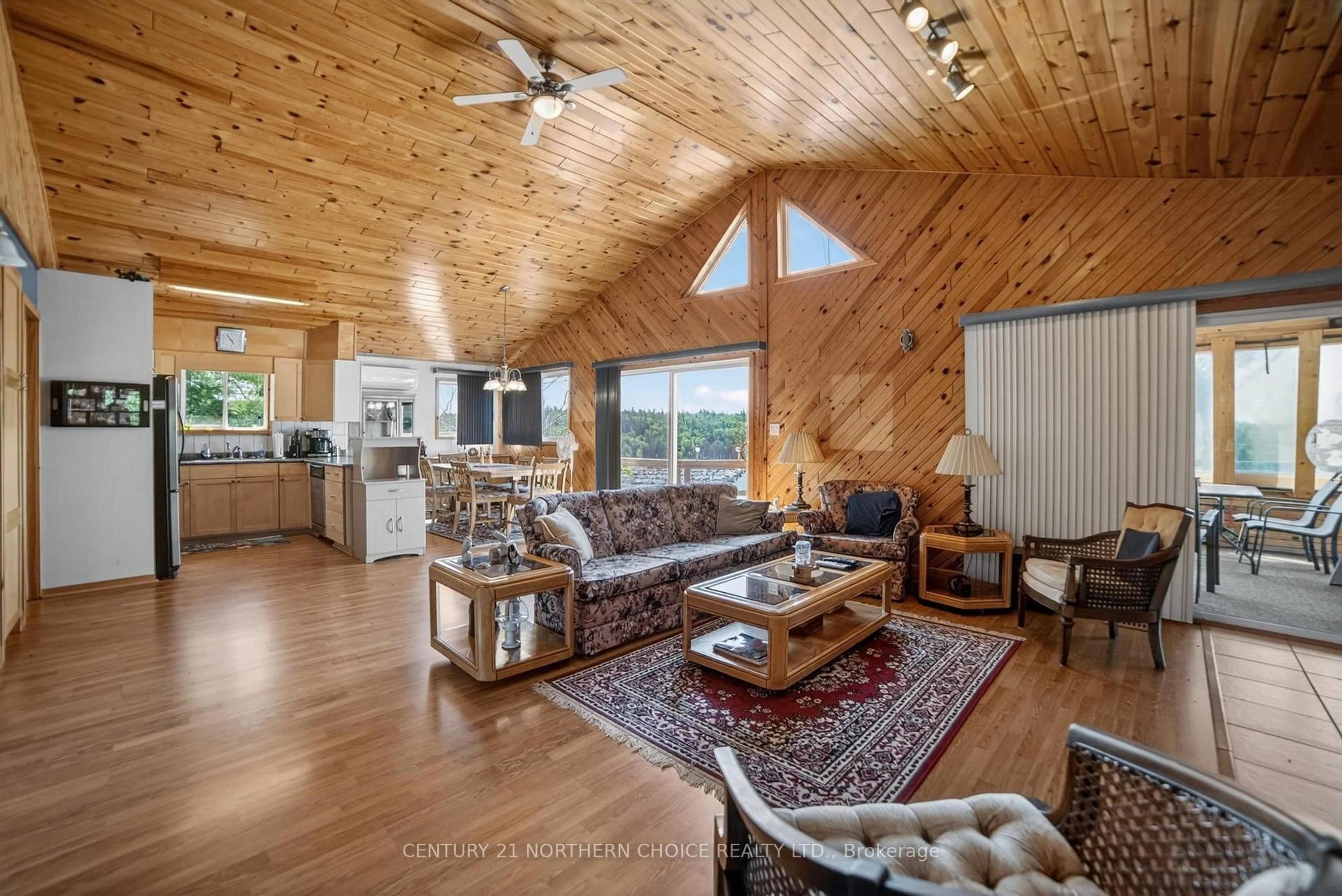 Living room with furniture, wood/laminate floor for 44 Bigstone Bay Lodge, Kenora Remote Area Ontario P9N 3W8