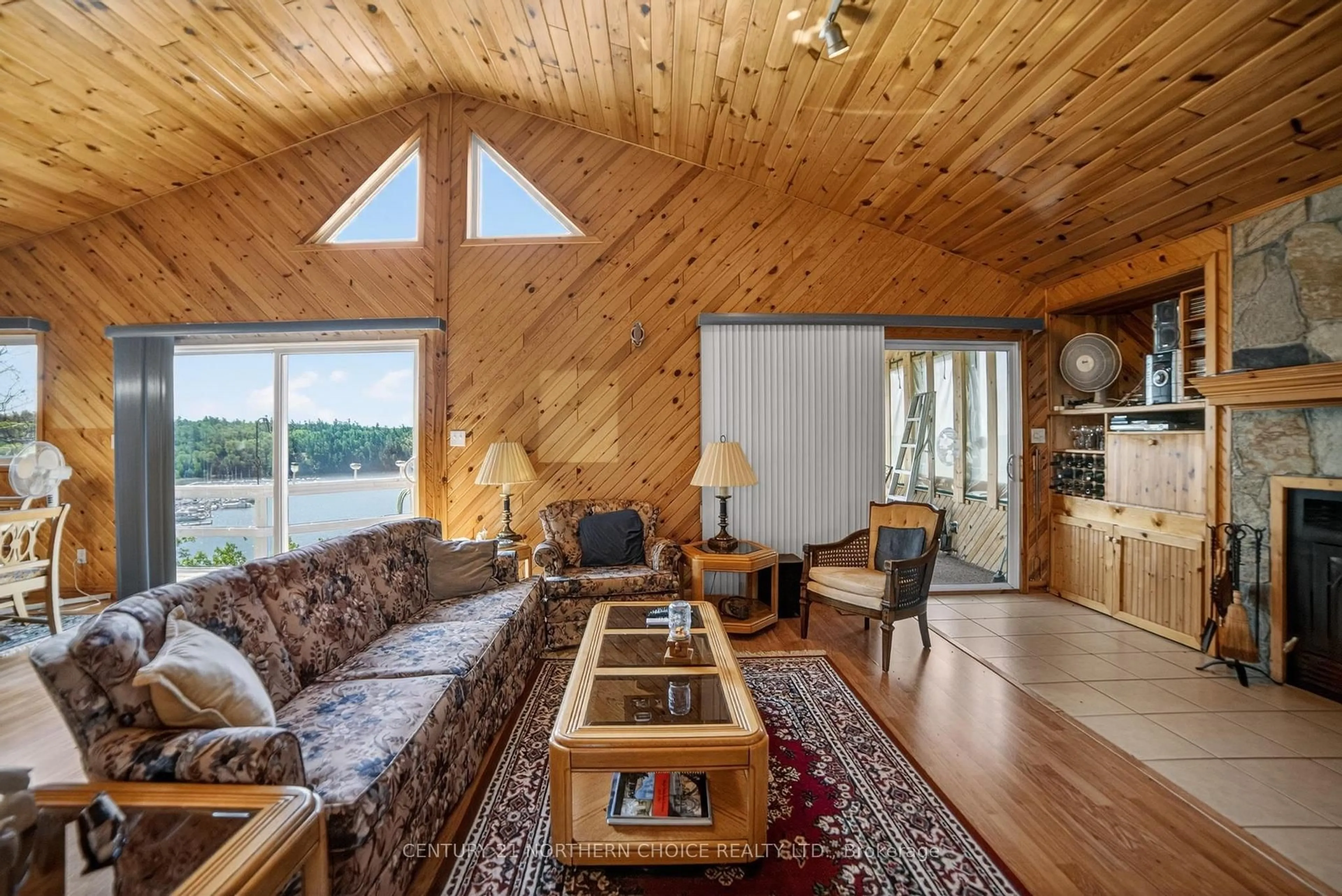 Living room with furniture, wood/laminate floor for 44 Bigstone Bay Lodge, Kenora Remote Area Ontario P9N 3W8