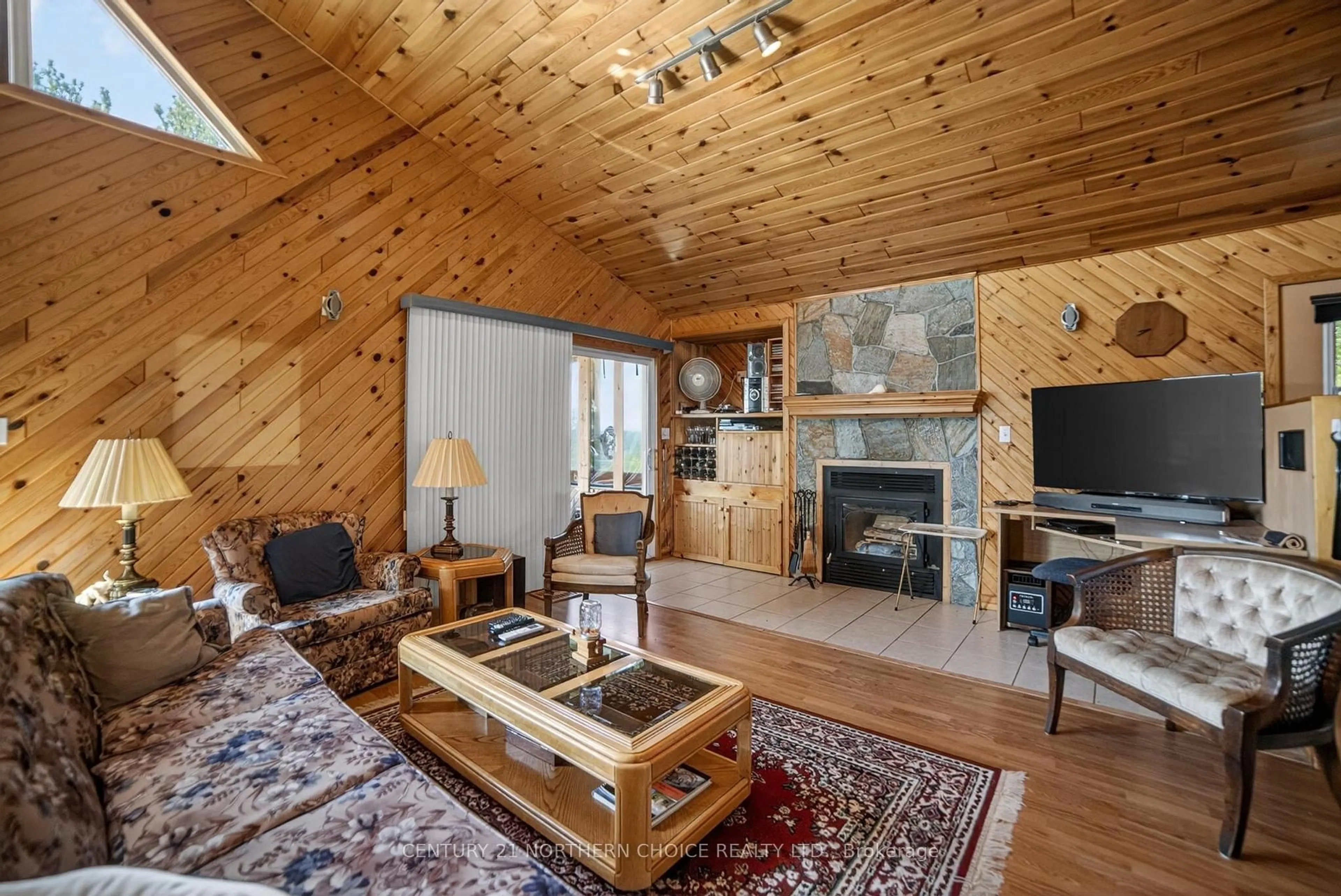Living room with furniture, wood/laminate floor for 44 Bigstone Bay Lodge, Kenora Remote Area Ontario P9N 3W8