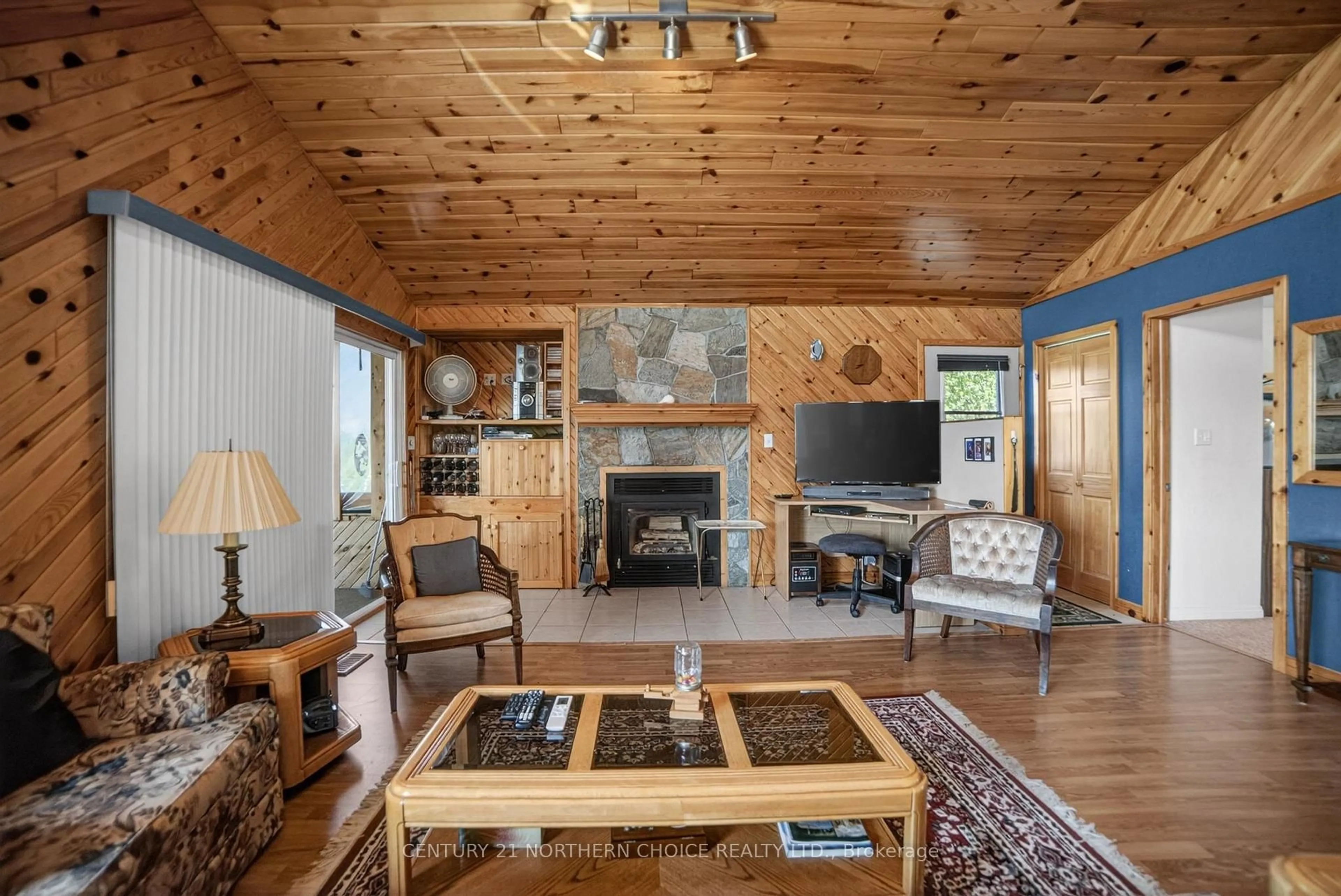Living room with furniture, wood/laminate floor for 44 Bigstone Bay Lodge, Kenora Remote Area Ontario P9N 3W8
