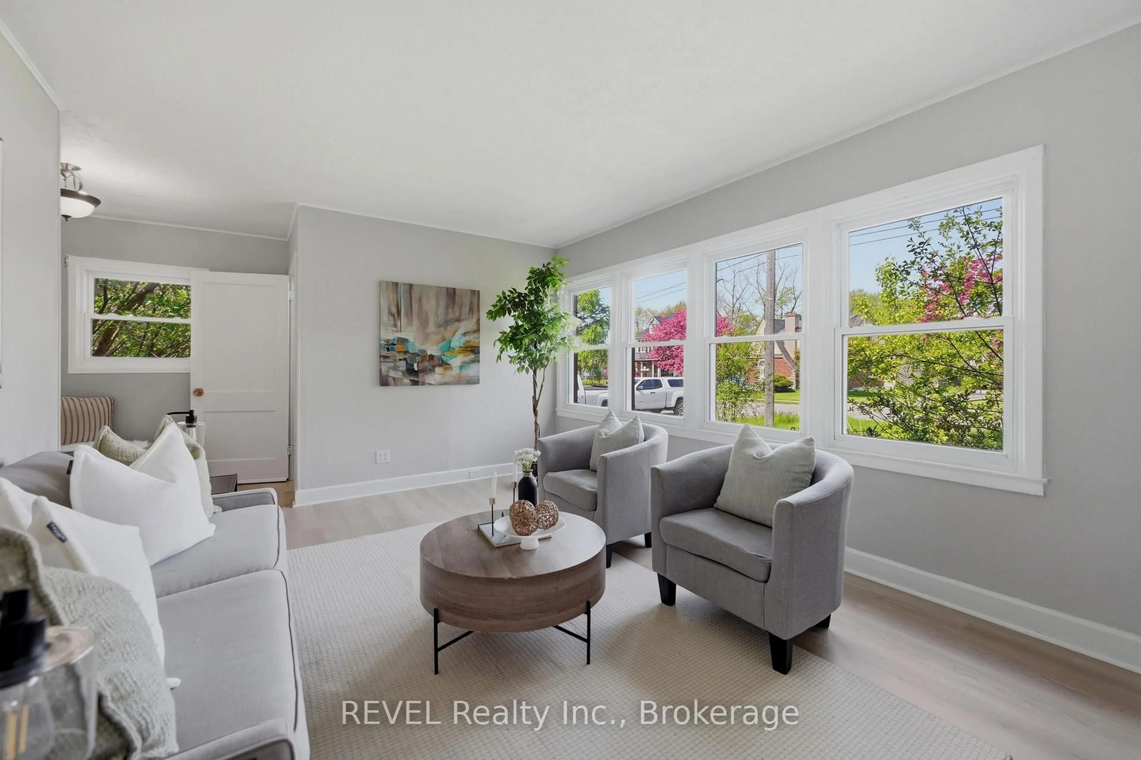 Living room with furniture, ceramic/tile floor for 7962 Booth St, Niagara Falls Ontario L2H 1E8