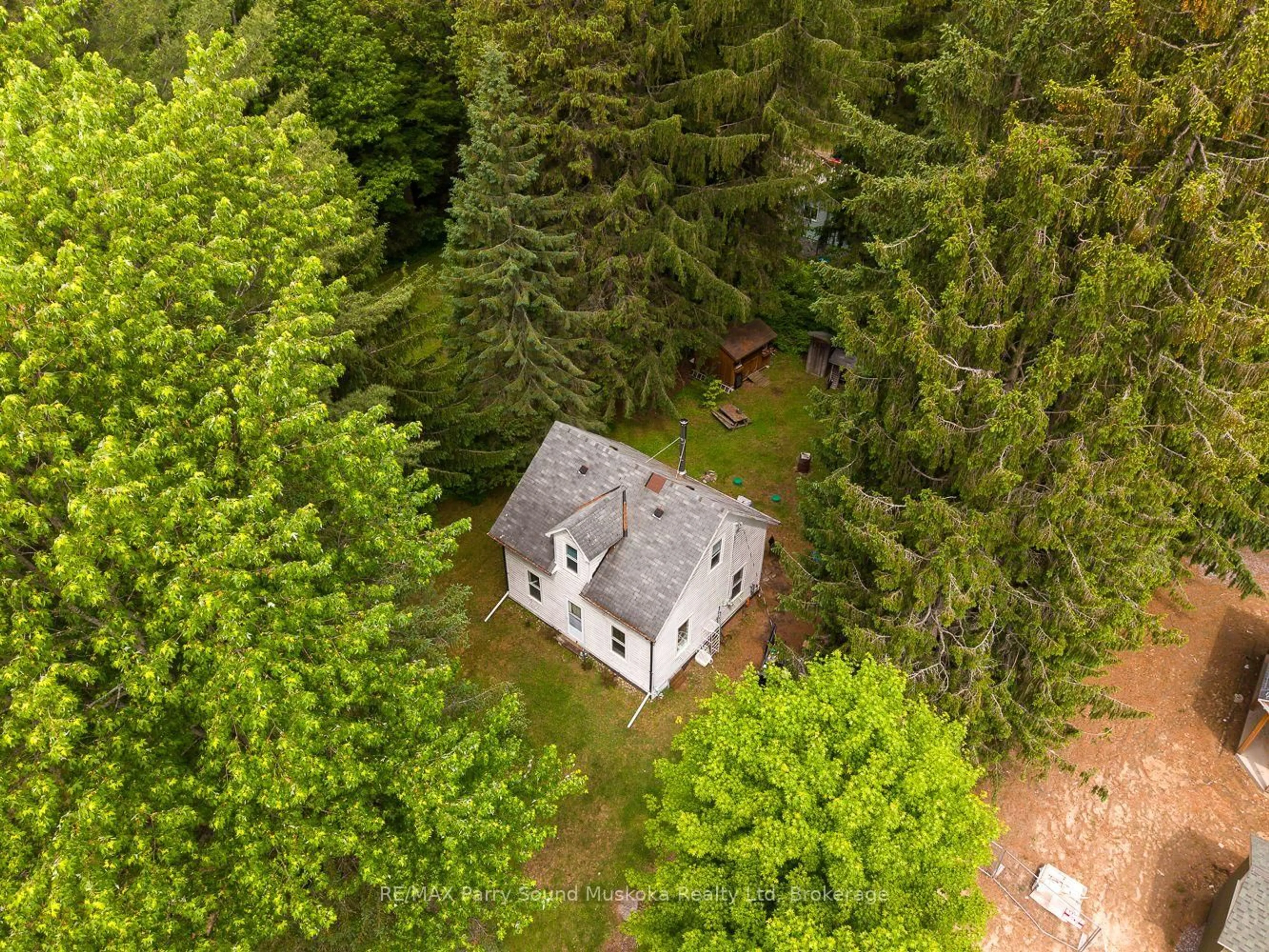 A pic from outside/outdoor area/front of a property/back of a property/a pic from drone, forest/trees view for 14 Victoria St, Seguin Ontario P0C 1J0