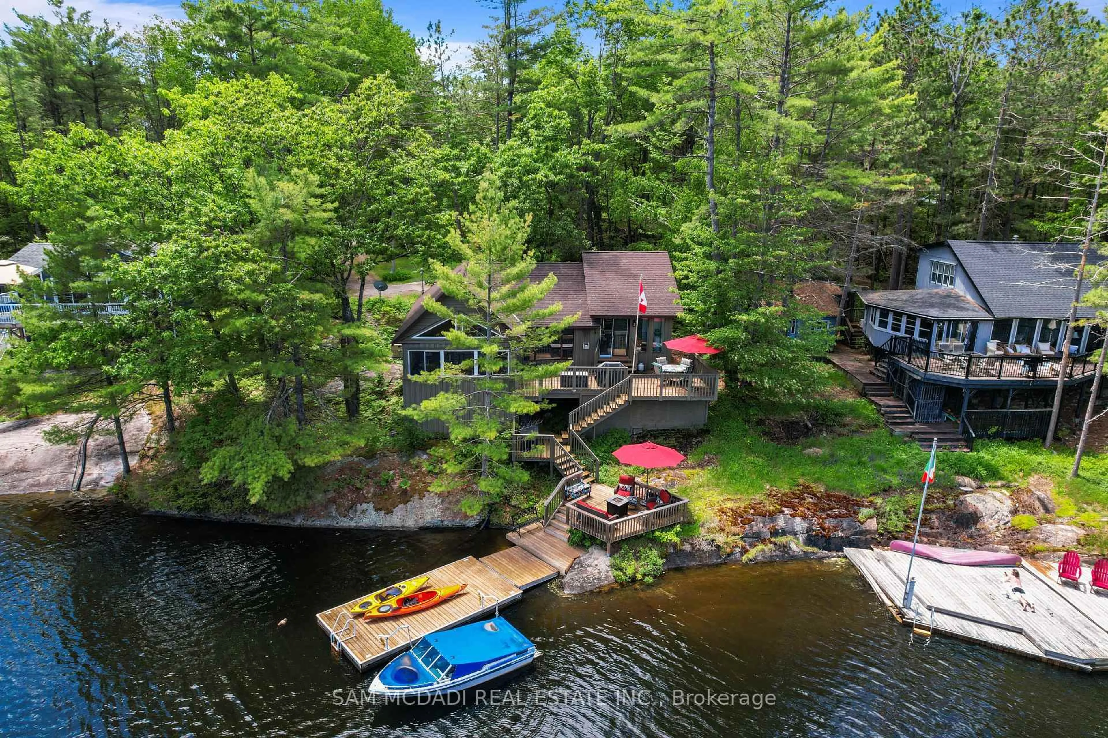 A pic from outside/outdoor area/front of a property/back of a property/a pic from drone, water/lake/river/ocean view for 11 Pinetree Rd S1 Rd, Gravenhurst Ontario P1P 1R2