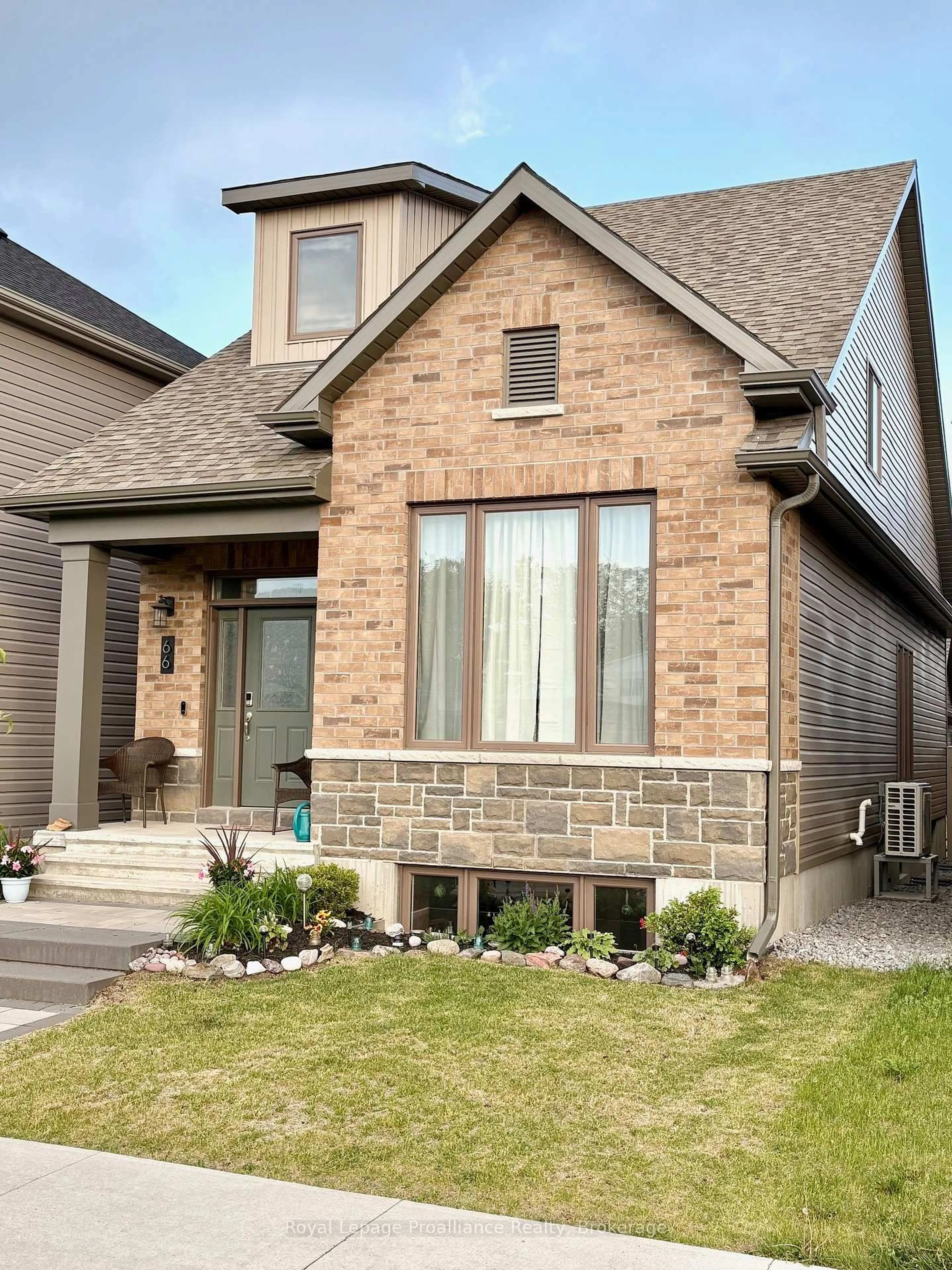 Home with brick exterior material, street for 66 Riverstone Way, Belleville Ontario K8N 0S6