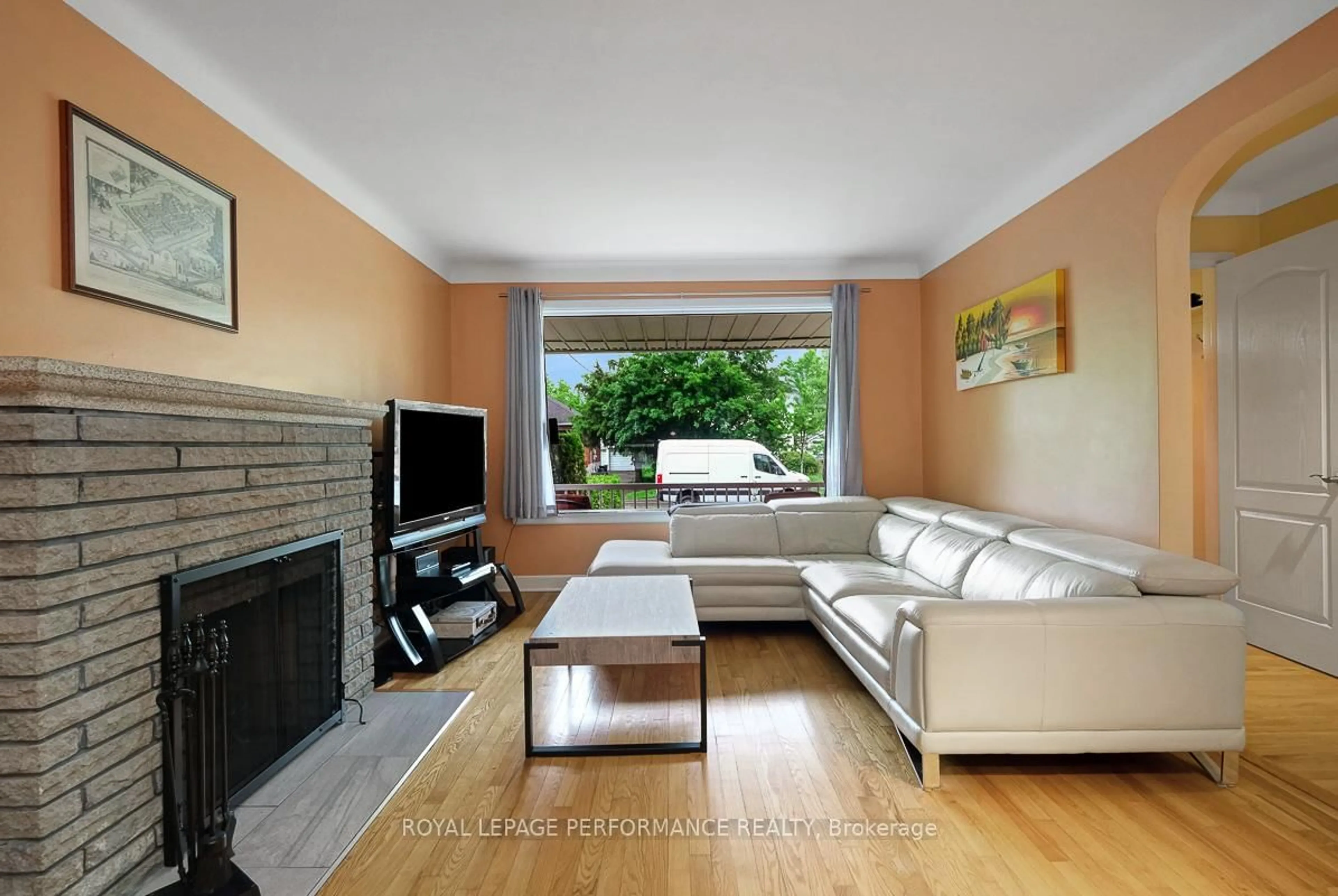 Living room with furniture, wood/laminate floor for 102 Donald St, Ottawa Ontario K1K 1N2