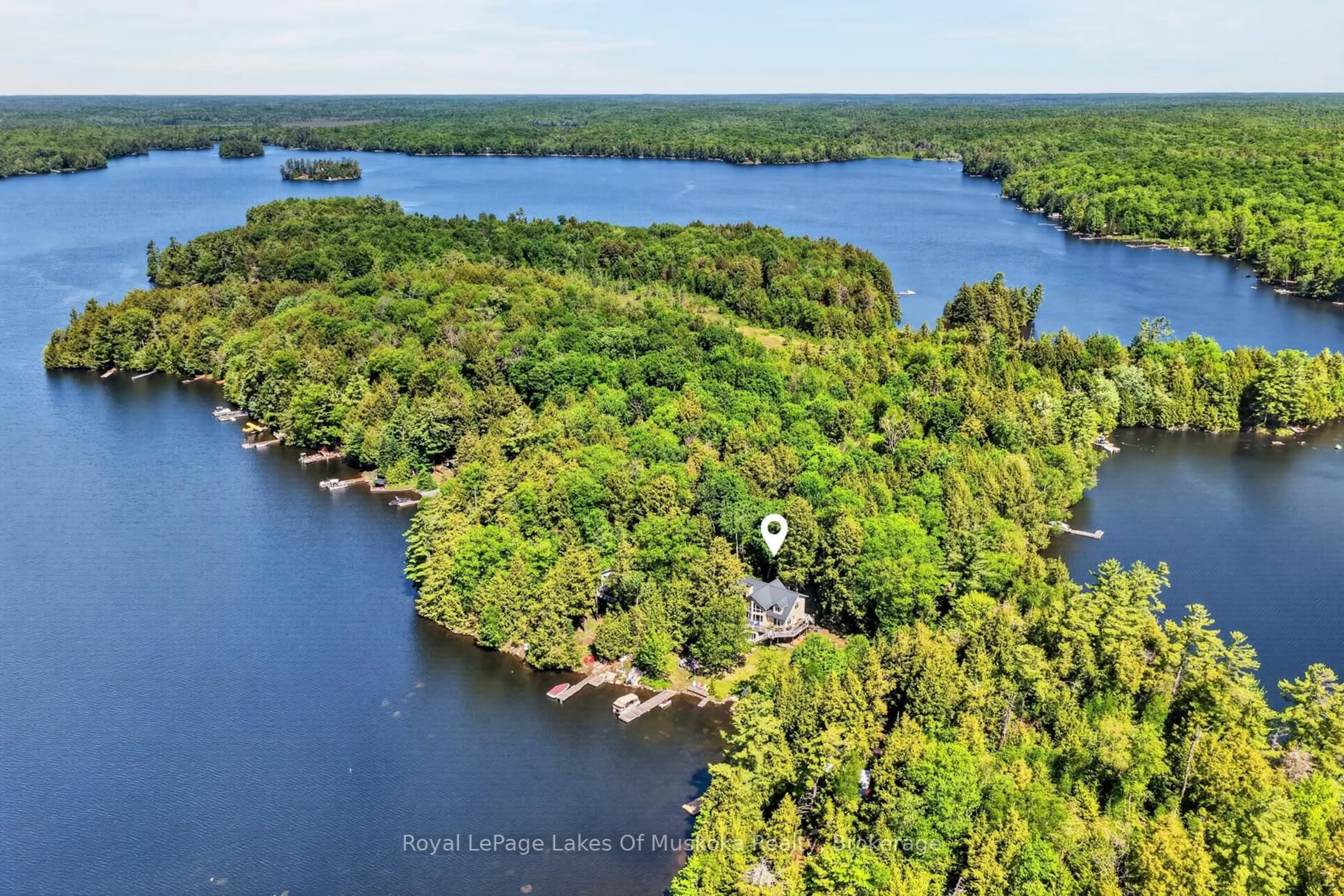 A pic from outside/outdoor area/front of a property/back of a property/a pic from drone, water/lake/river/ocean view for 206 MacBeth Island, Bracebridge Ontario P1L 1X1
