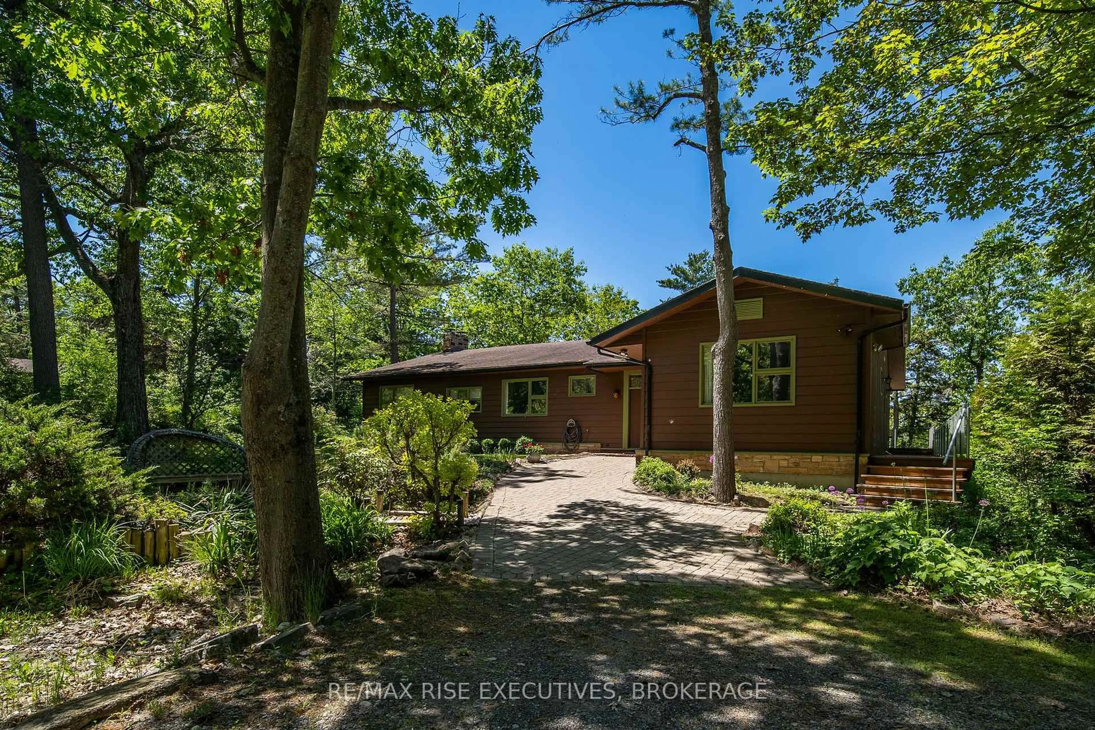 A pic from outside/outdoor area/front of a property/back of a property/a pic from drone, forest/trees view for 22 The Point Rd, Kingston Ontario K7K 5E2