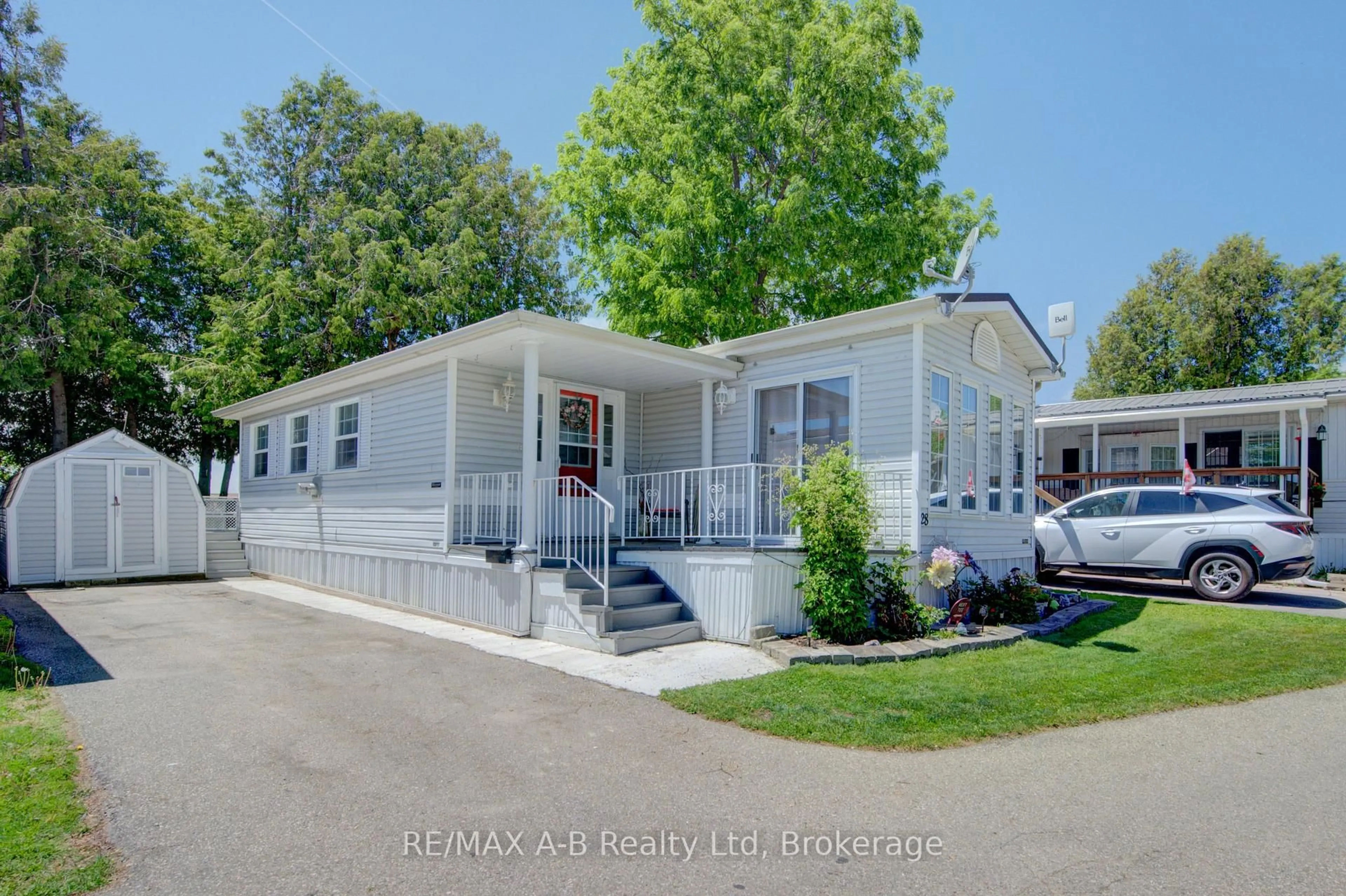 Home with vinyl exterior material, street for 595487 Highway 59 North, Rr6 Woodstock - Unit Highway #28, East Zorra-Tavistock Ontario N4S 7W1