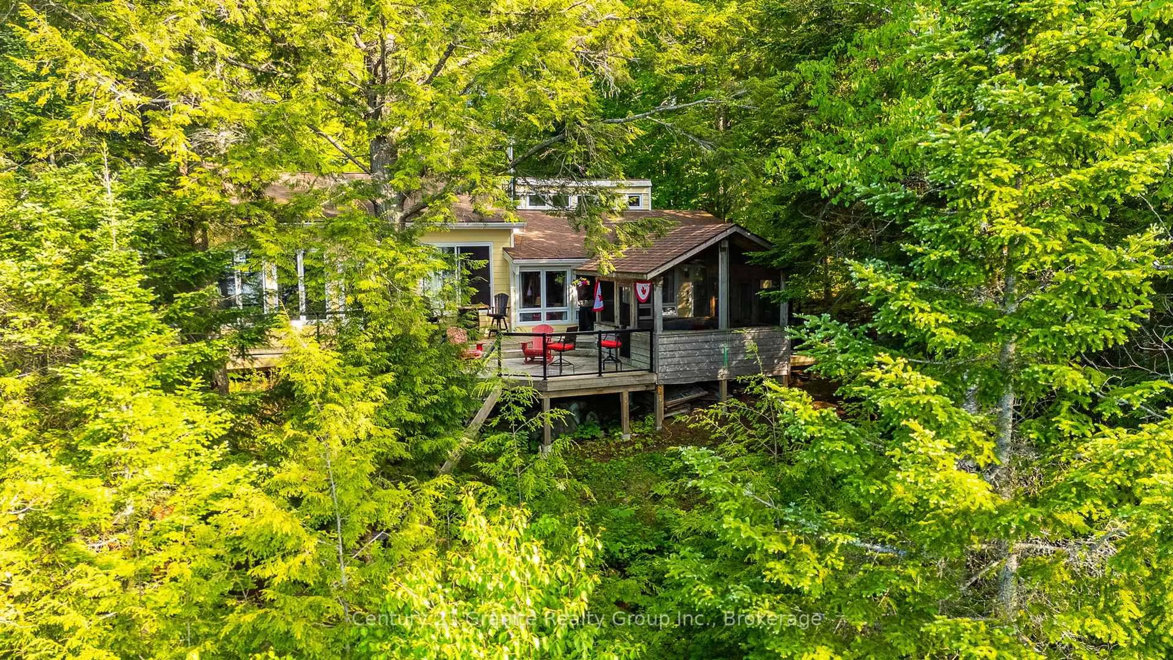 A pic from outside/outdoor area/front of a property/back of a property/a pic from drone, water/lake/river/ocean view for 1075 Wampum Rd, Dysart et al Ontario K0M 1S0