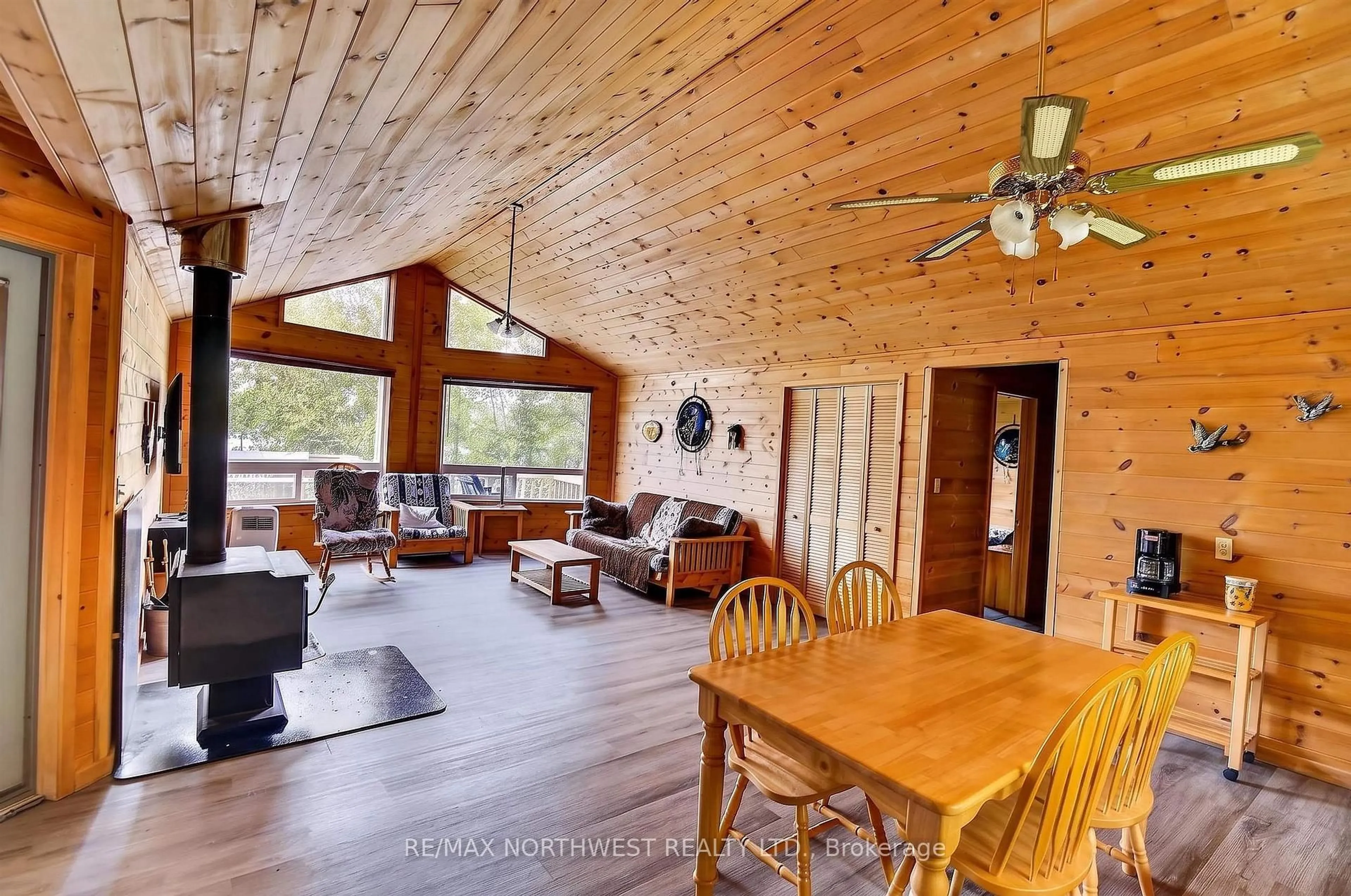 Living room with furniture, wood/laminate floor for 2747 Moore Bay, Sioux Narrows-Nestor Falls Ontario P0X 1H0