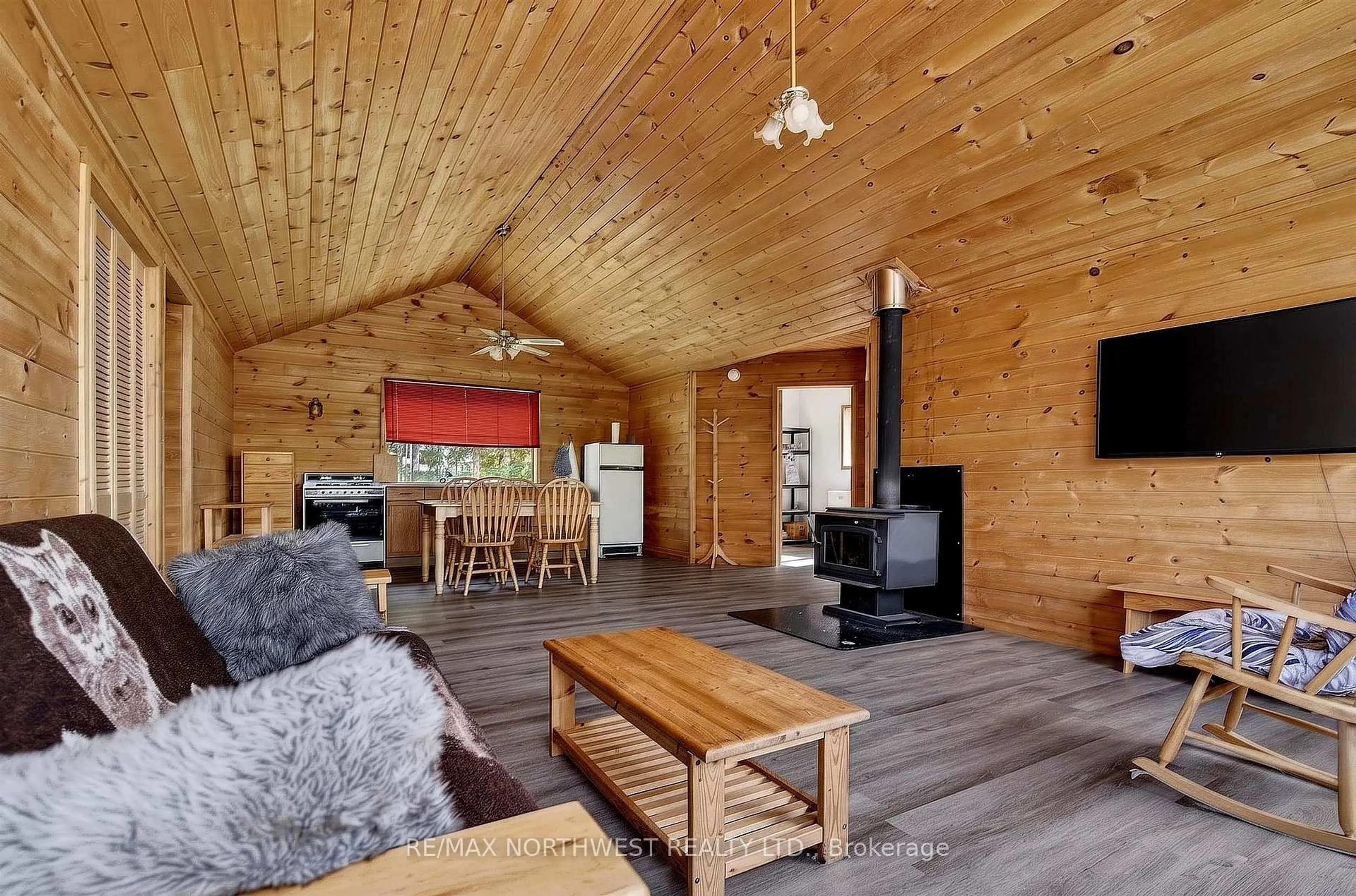 Living room with furniture, wood/laminate floor for 2747 Moore Bay, Sioux Narrows-Nestor Falls Ontario P0X 1H0