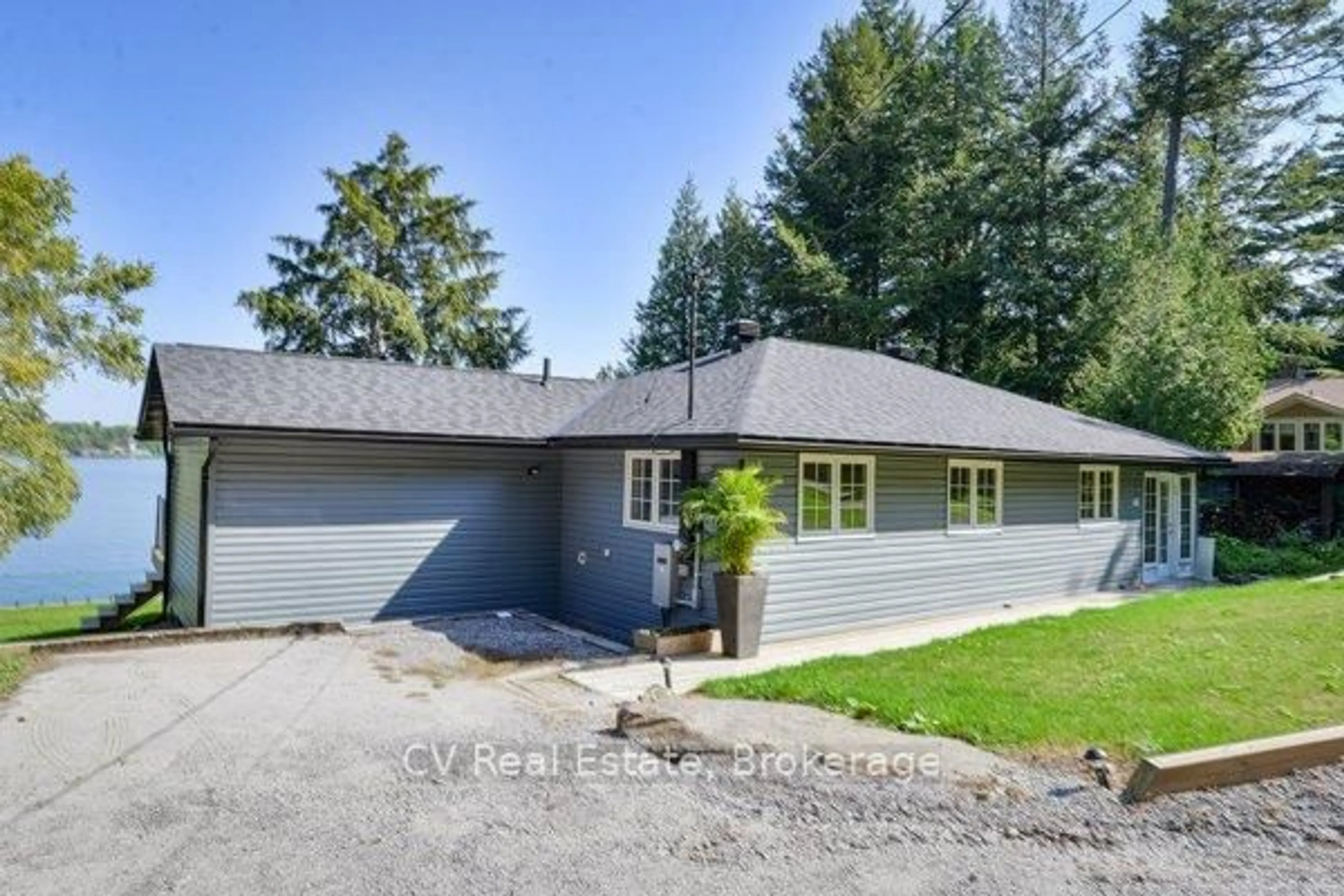 A pic from outside/outdoor area/front of a property/back of a property/a pic from drone, street for 1018 Georgina Way #1, Gravenhurst Ontario P1P 1R2