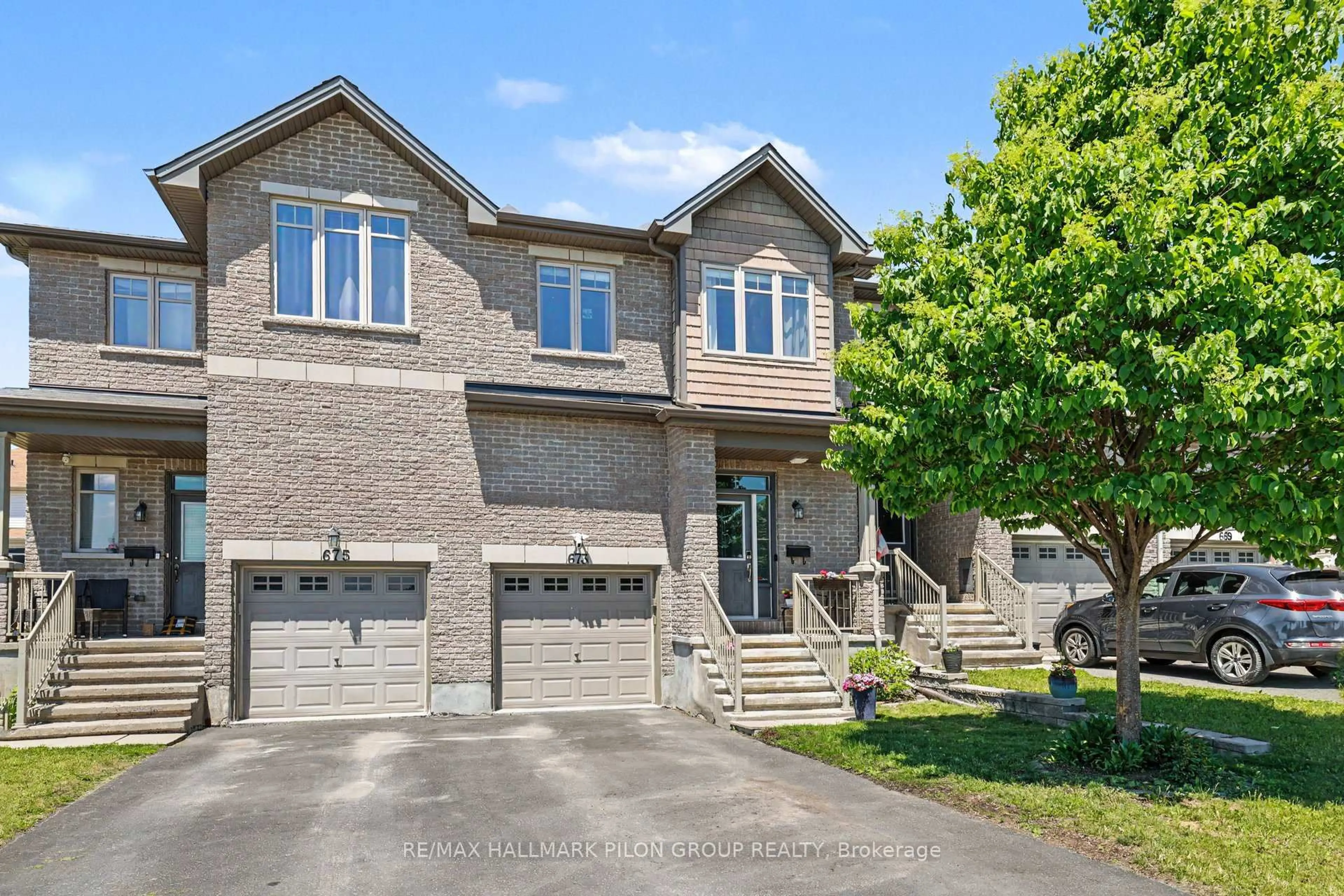 Home with brick exterior material, street for 673 Spring Valley Dr, Orleans Ontario K1W 0C7