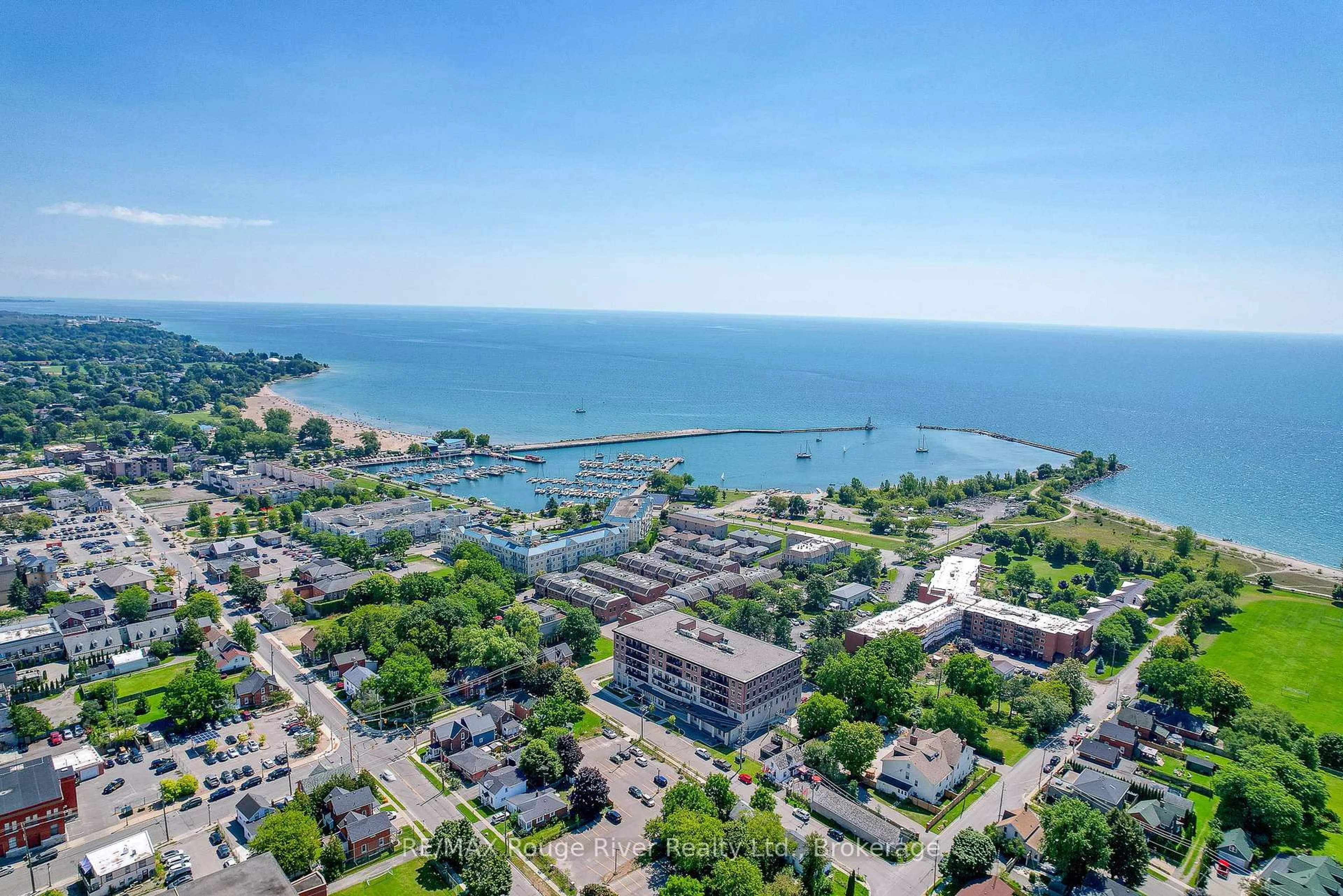 A pic from outside/outdoor area/front of a property/back of a property/a pic from drone, water/lake/river/ocean view for 135 Orr St #212, Cobourg Ontario K9A 0J6