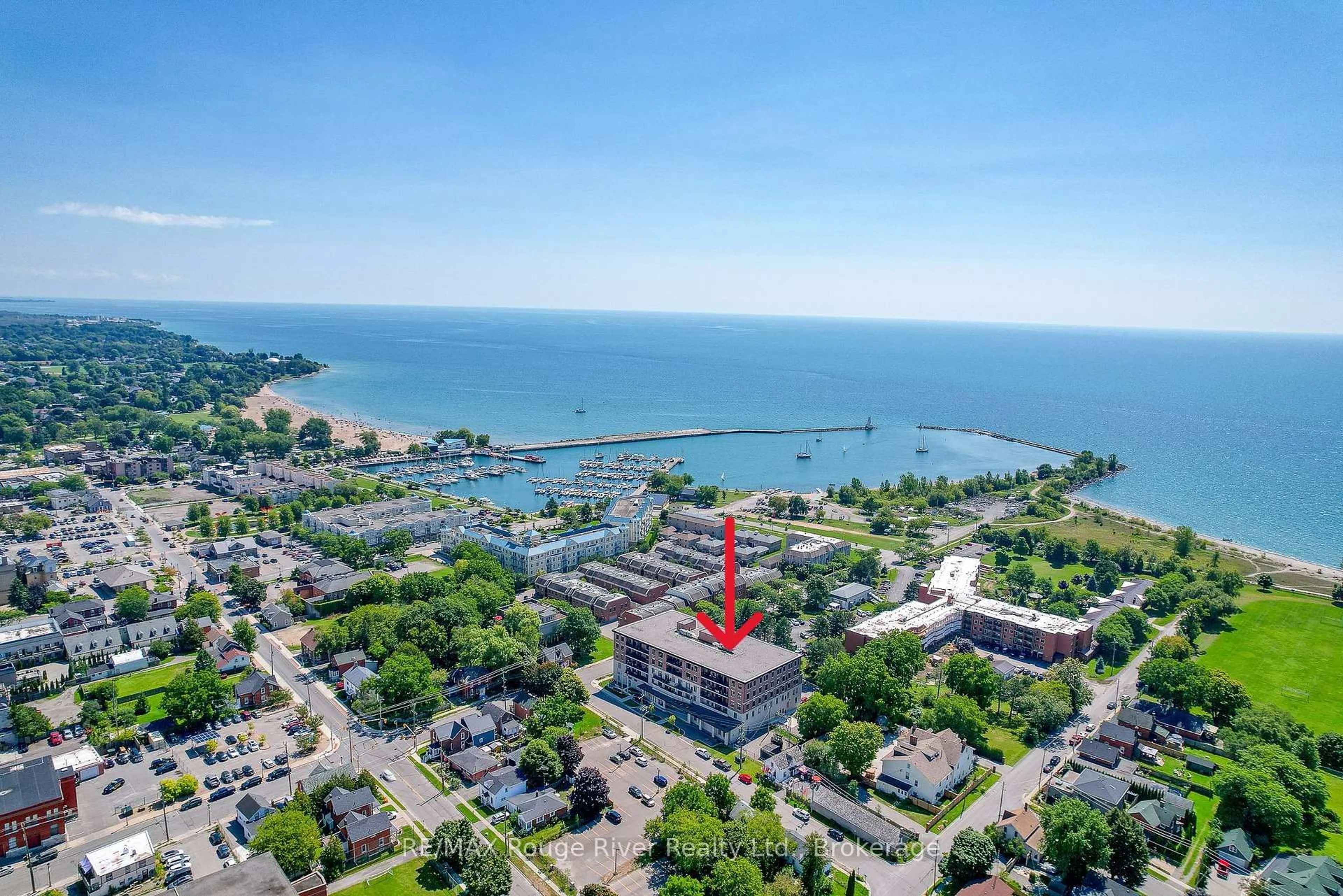 A pic from outside/outdoor area/front of a property/back of a property/a pic from drone, water/lake/river/ocean view for 135 Orr St #212, Cobourg Ontario K9A 0J6