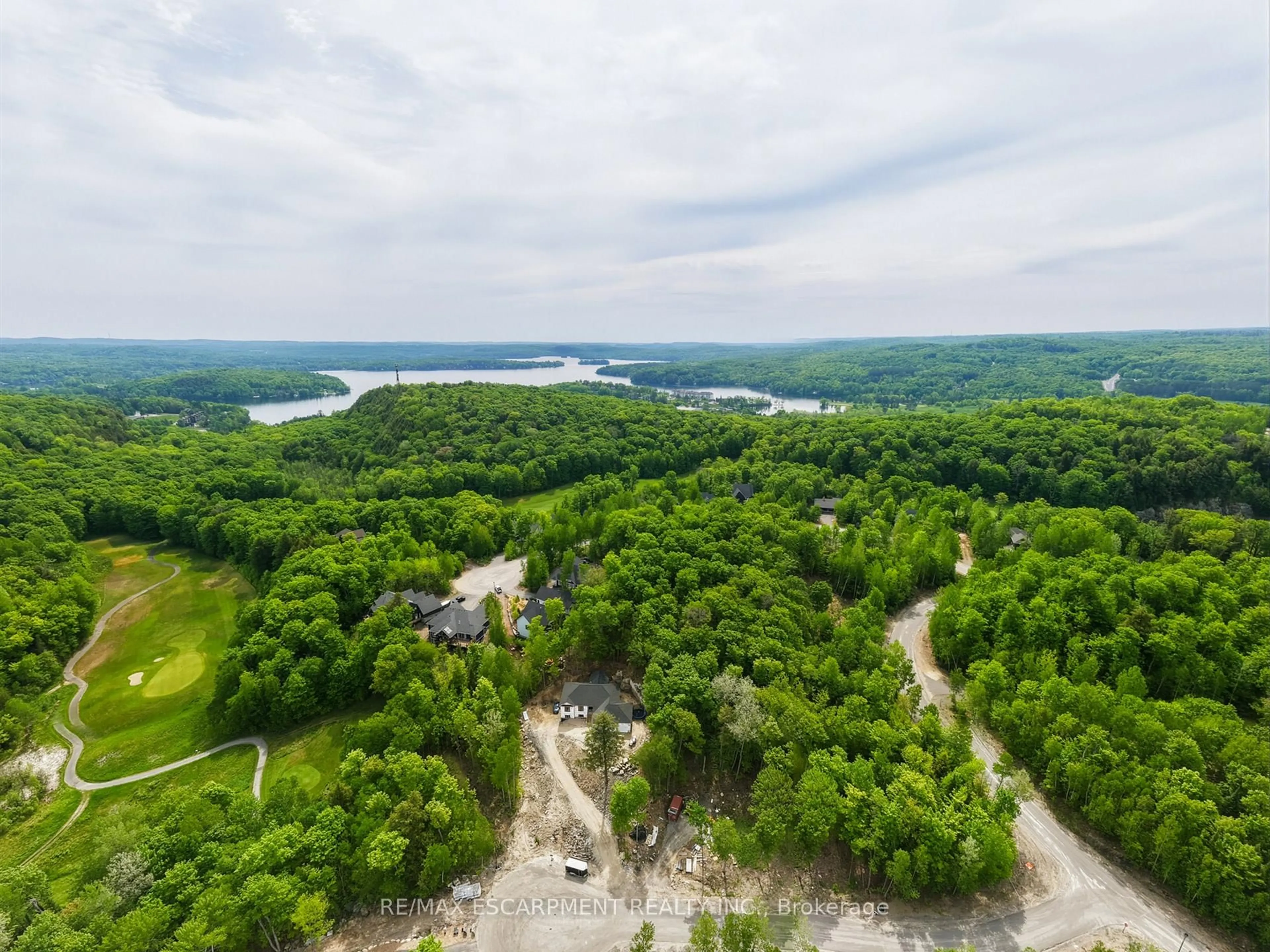 A pic from outside/outdoor area/front of a property/back of a property/a pic from drone, water/lake/river/ocean view for 8 Glen Eagle Crt, Huntsville Ontario P1H 1B1