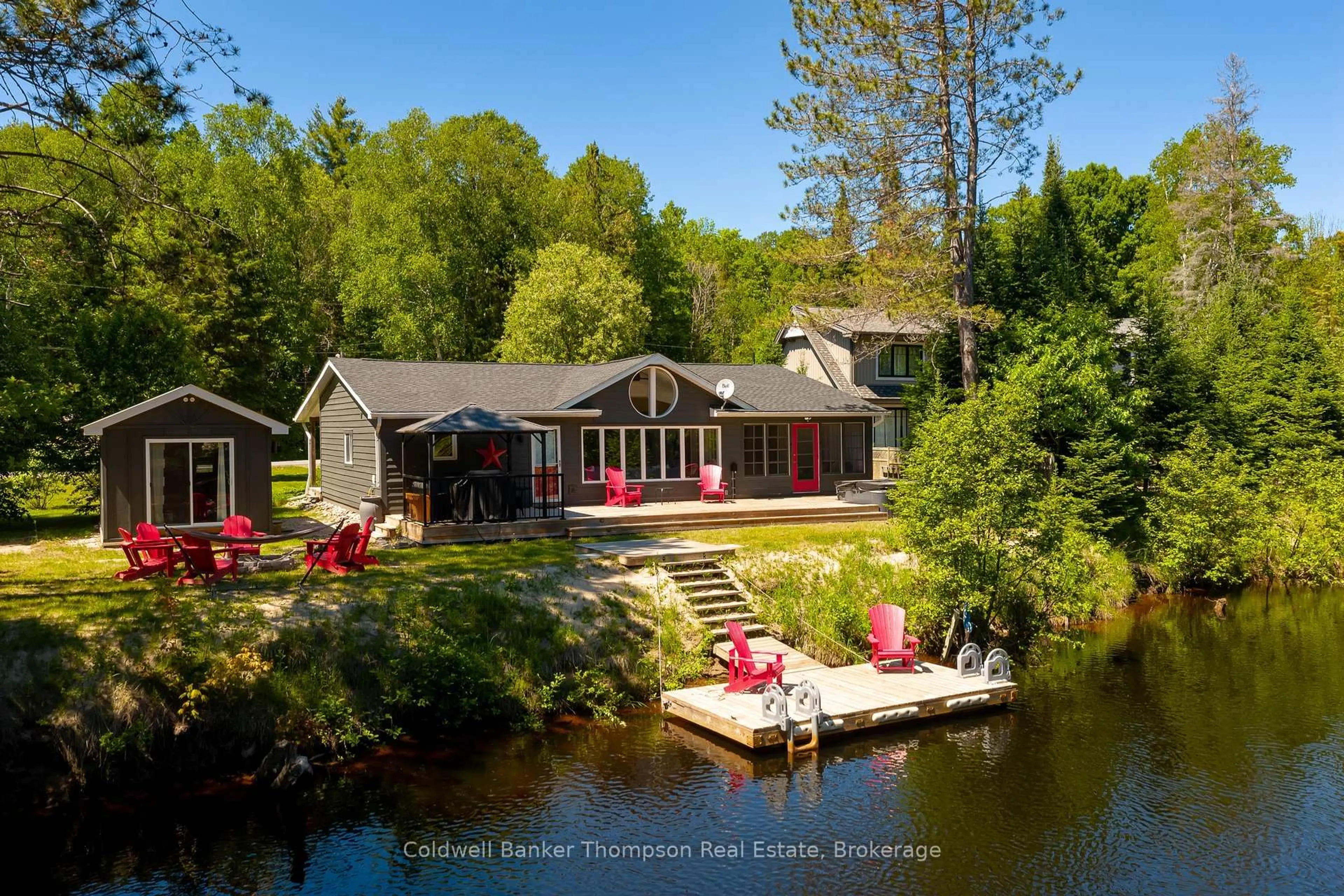 A pic from outside/outdoor area/front of a property/back of a property/a pic from drone, water/lake/river/ocean view for 31 Glen Acres Rd, Huntsville Ontario P1H 1N6