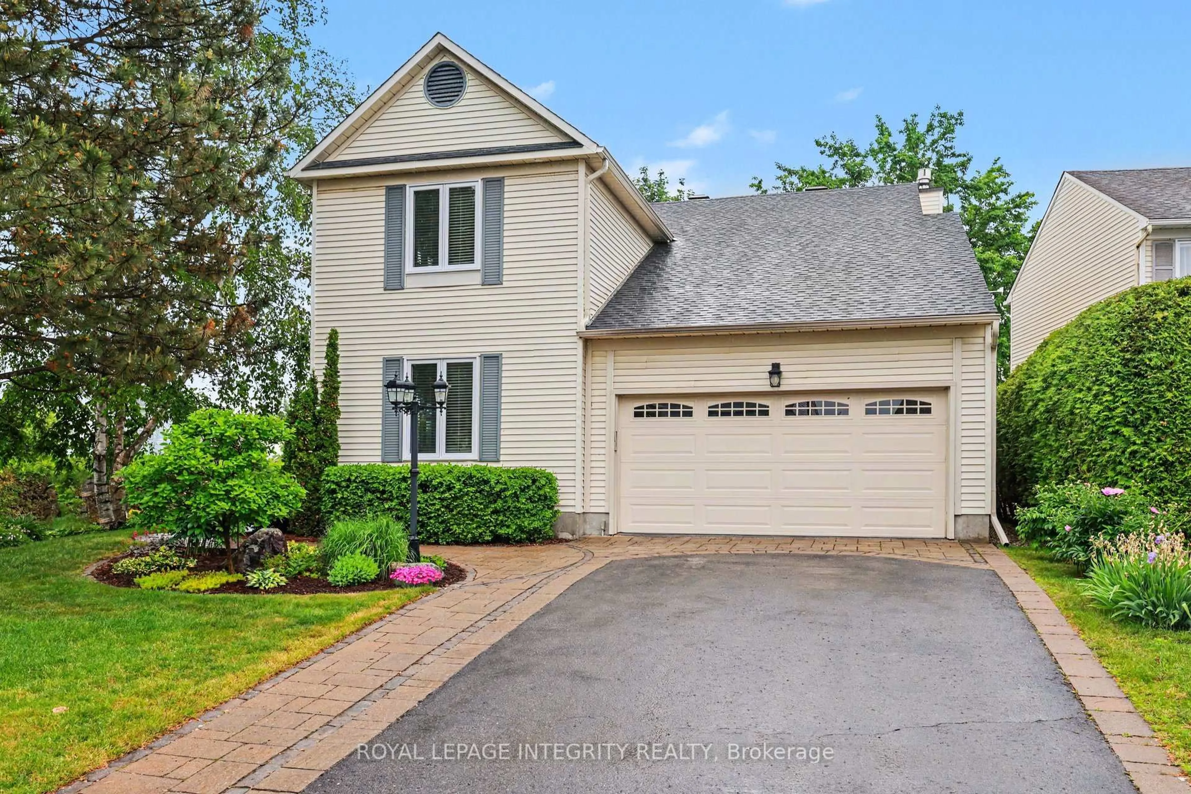 Home with vinyl exterior material, street for 1642 Champneuf Dr, Orleans Ontario K1C 4W1