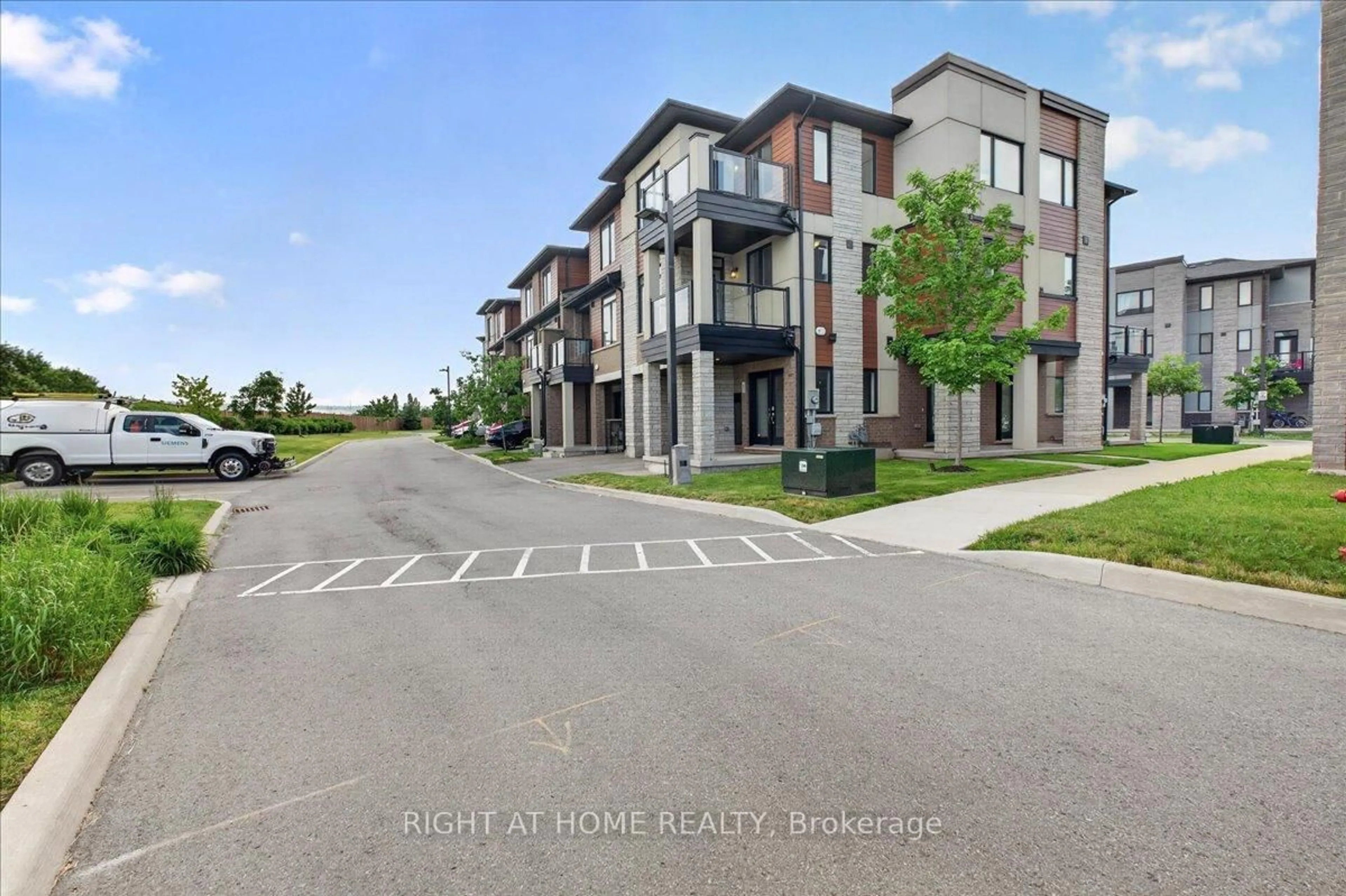 A pic from outside/outdoor area/front of a property/back of a property/a pic from drone, street for 590 North Service Rd #67, Hamilton Ontario L8E 0K5