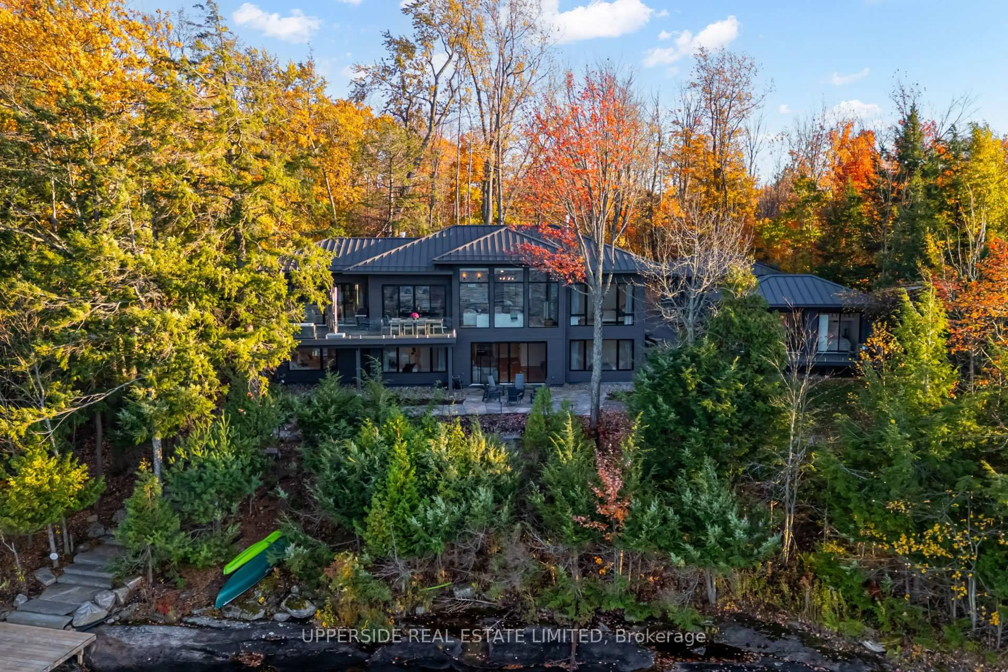 A pic from outside/outdoor area/front of a property/back of a property/a pic from drone, water/lake/river/ocean view for 1348 Stephens Bay Rd, Bracebridge Ontario P1L 1X2