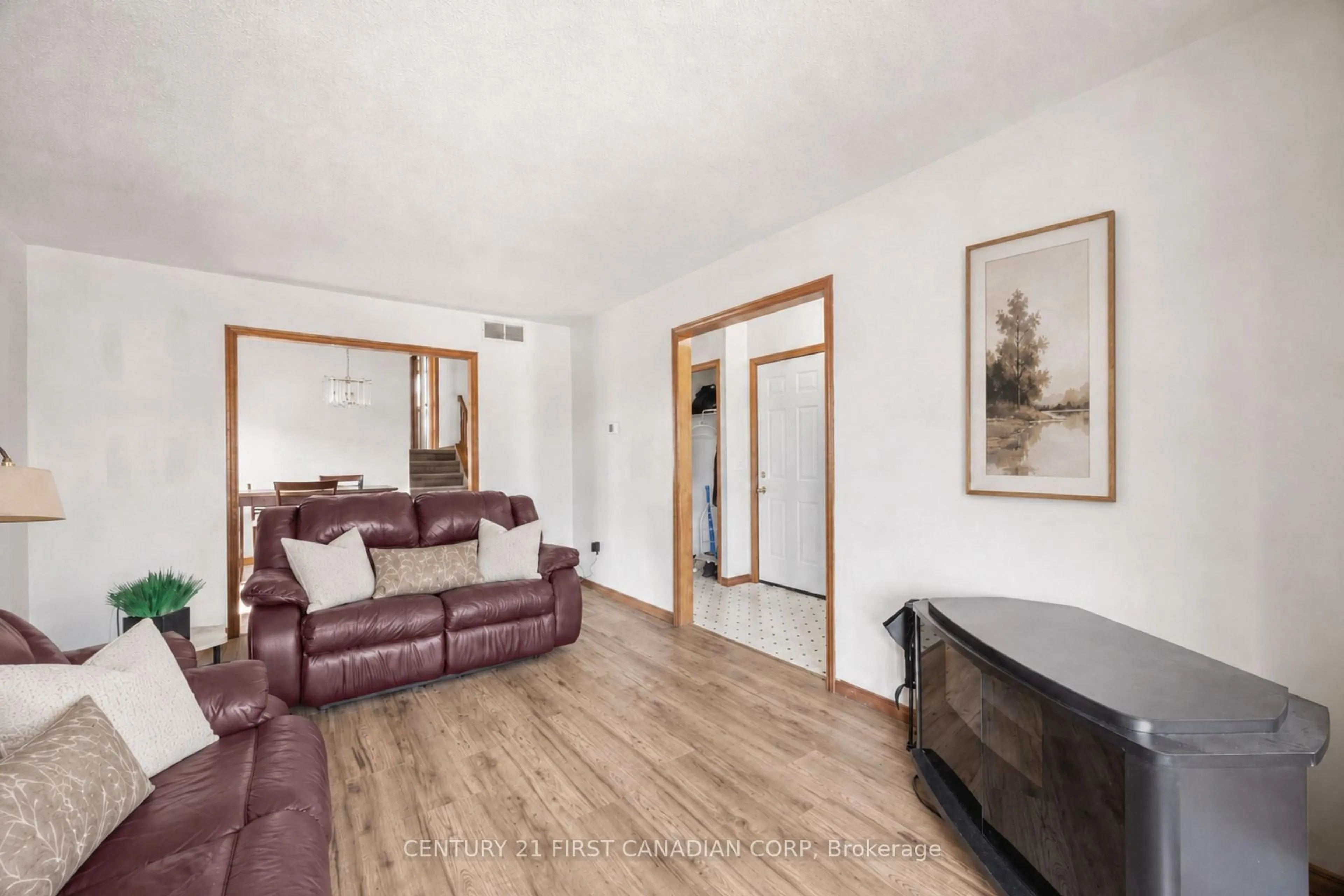 Living room with furniture, wood/laminate floor for 351 Fleming Dr, London East Ontario N5V 4Y6