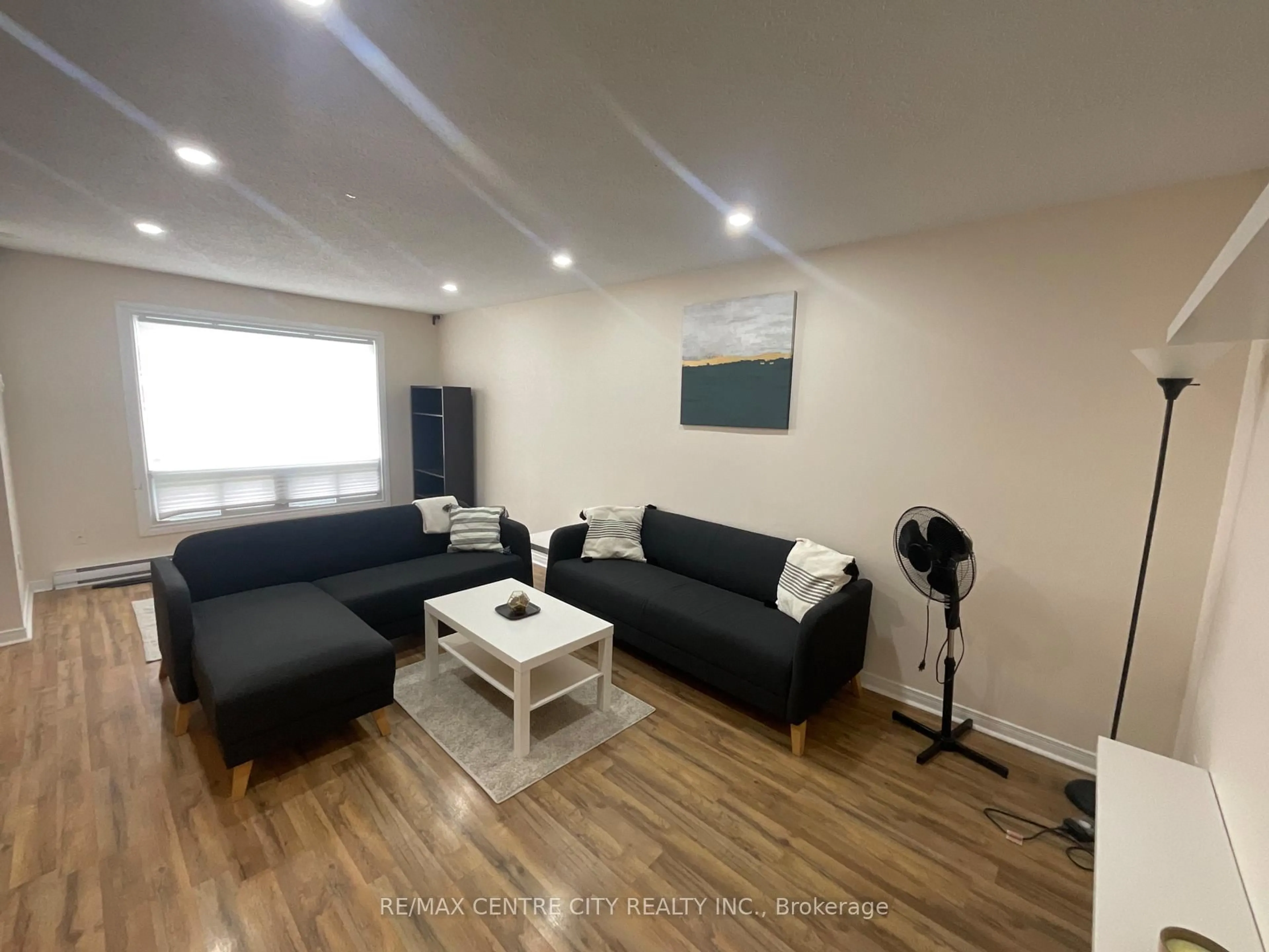 Living room with furniture, wood/laminate floor for 158 Monmore Rd, London North Ontario N6G 3A6