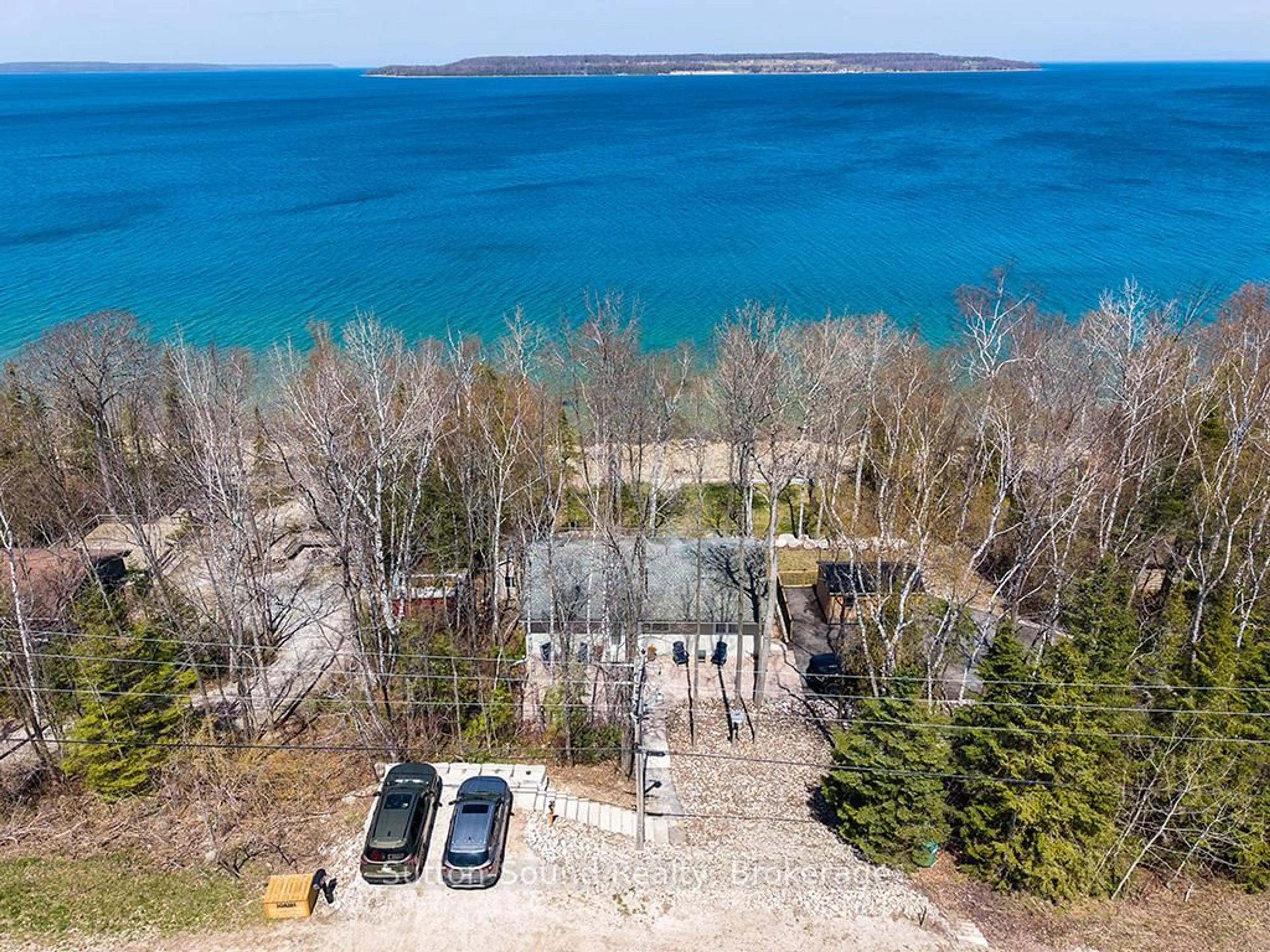 A pic from outside/outdoor area/front of a property/back of a property/a pic from drone, water/lake/river/ocean view for 504389 GREY ROAD 1, Georgian Bluffs Ontario N0H 2T0
