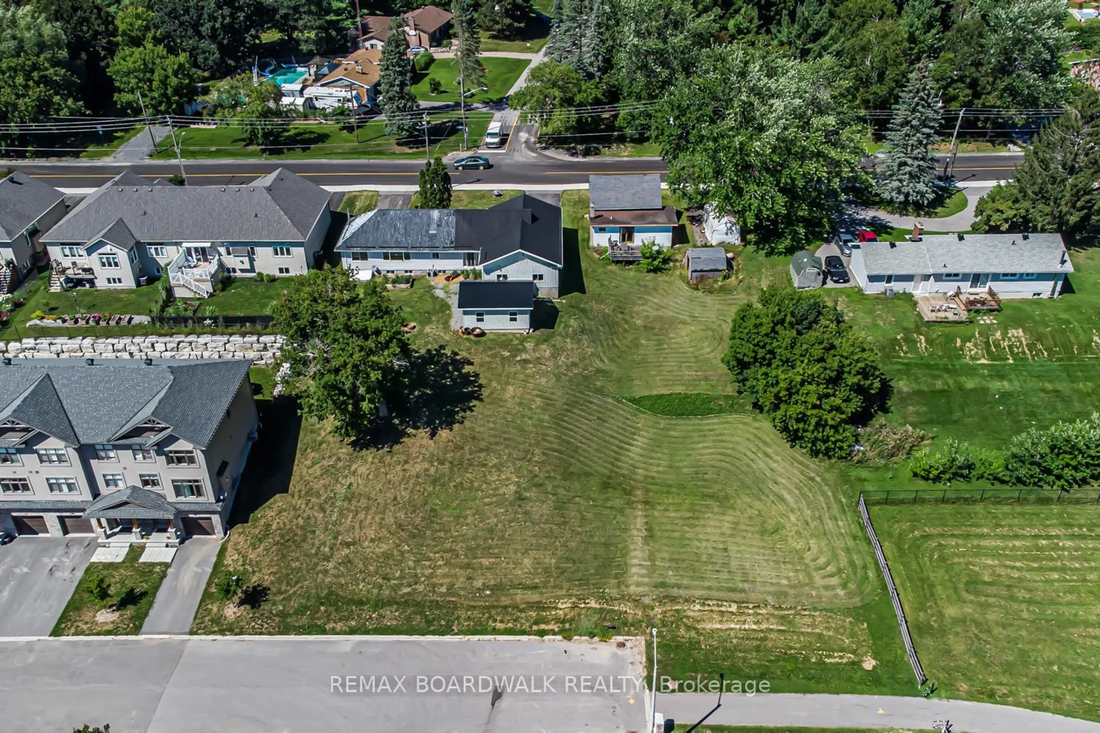 A pic from outside/outdoor area/front of a property/back of a property/a pic from drone, street for 303-307 DONALD B MUNRO Dr, Carp Ontario K0A 1L0