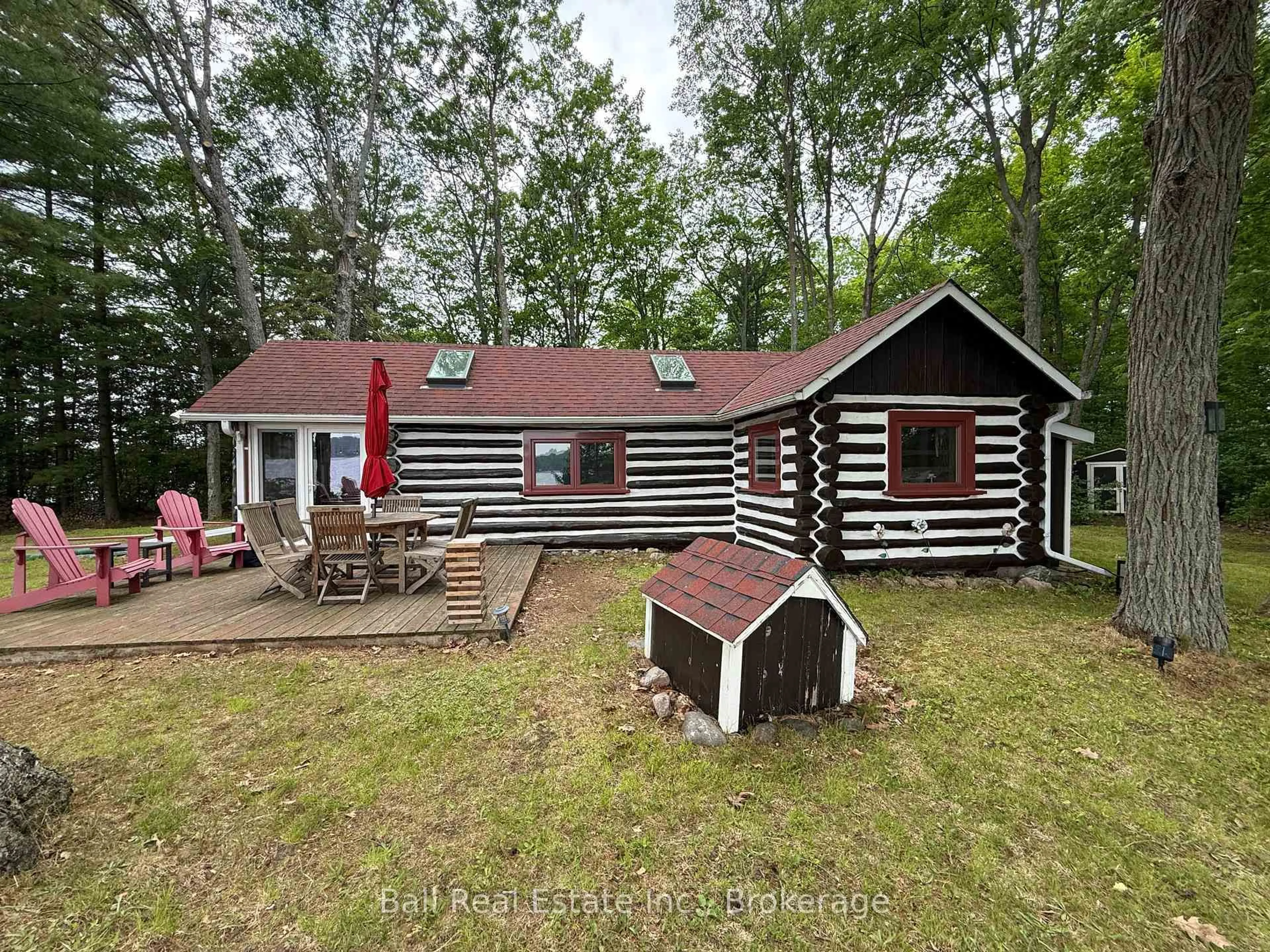 A pic from outside/outdoor area/front of a property/back of a property/a pic from drone, forest/trees view for 927 Kelly Island, Selwyn Ontario K0L 1H0