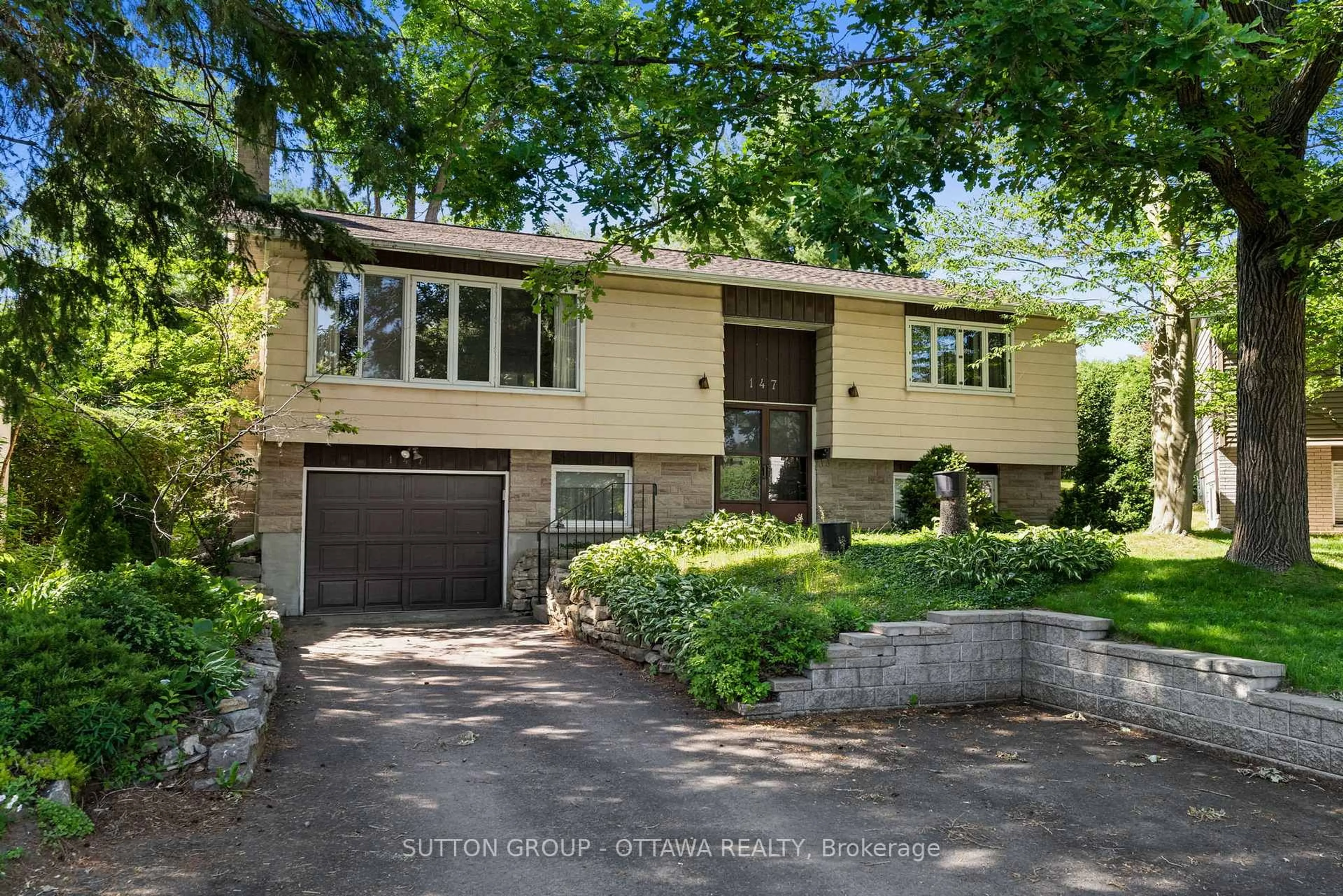Home with brick exterior material, street for 147 Banning Rd, Ottawa Ontario K2L 1C5
