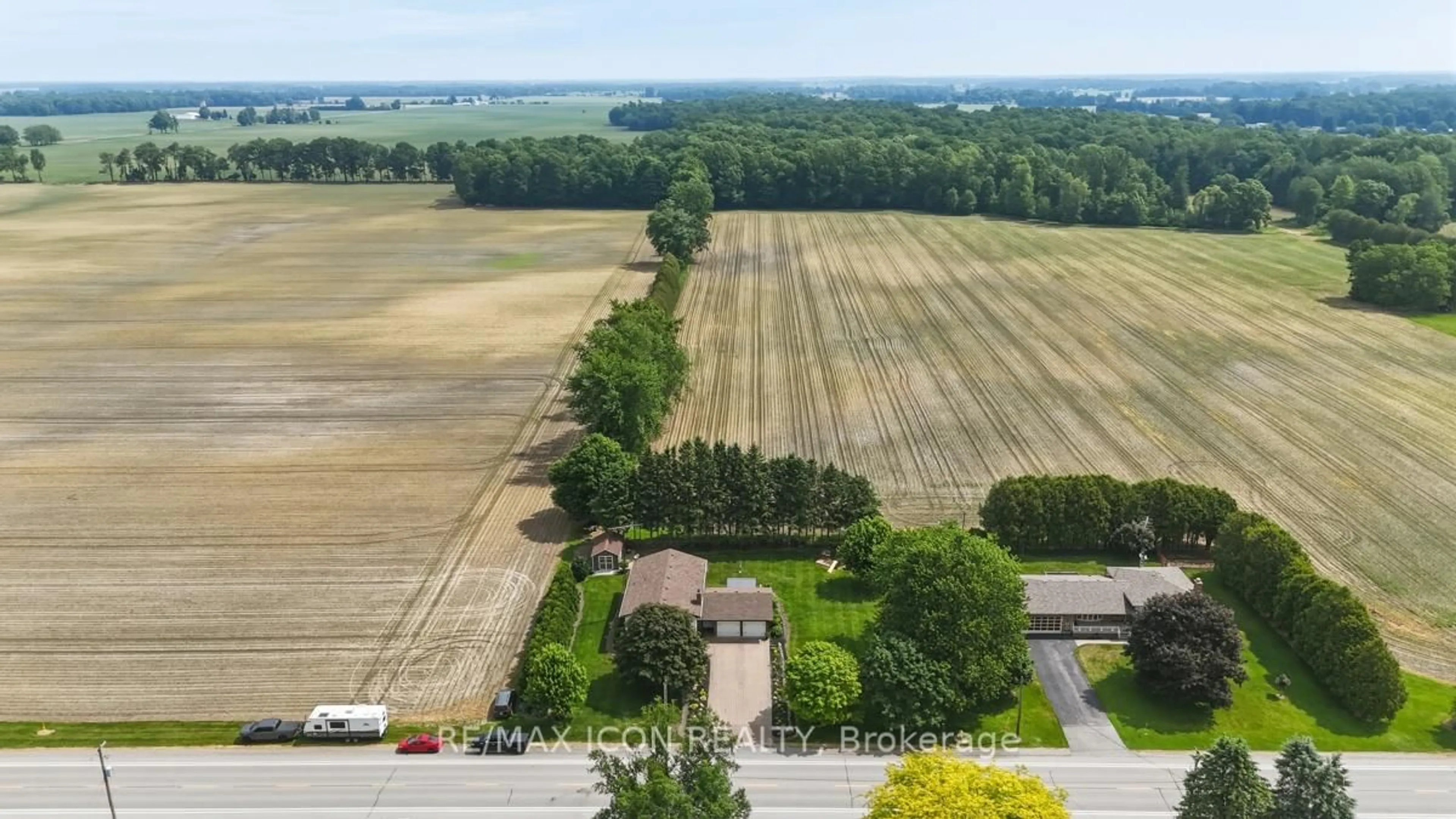 A pic from outside/outdoor area/front of a property/back of a property/a pic from drone, forest/trees view for 10810 Graham Rd, West Elgin Ontario N0L 2P0