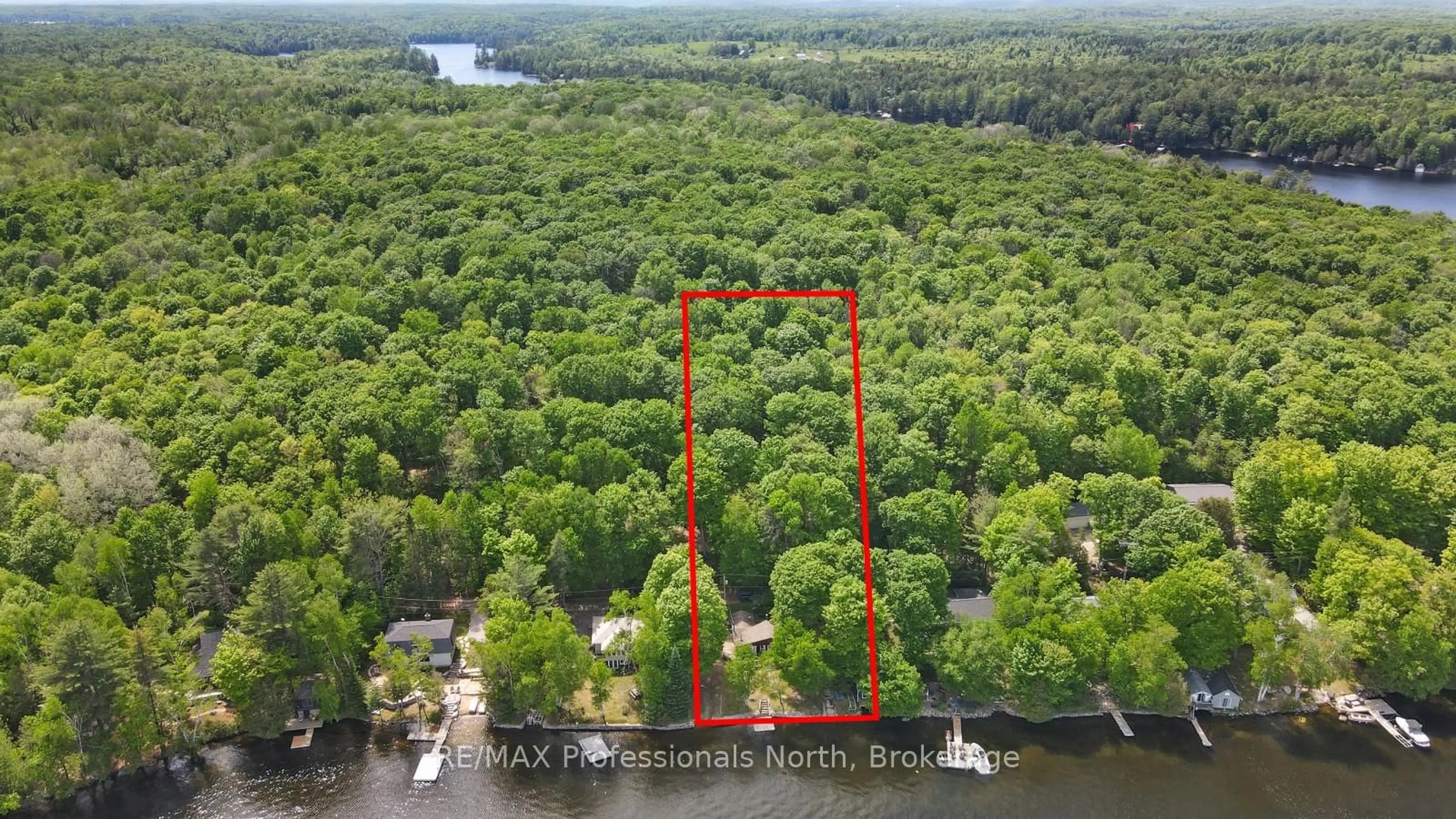 A pic from outside/outdoor area/front of a property/back of a property/a pic from drone, water/lake/river/ocean view for 1024 NORANDY Lane, Minden Hills Ontario K0M 2K0