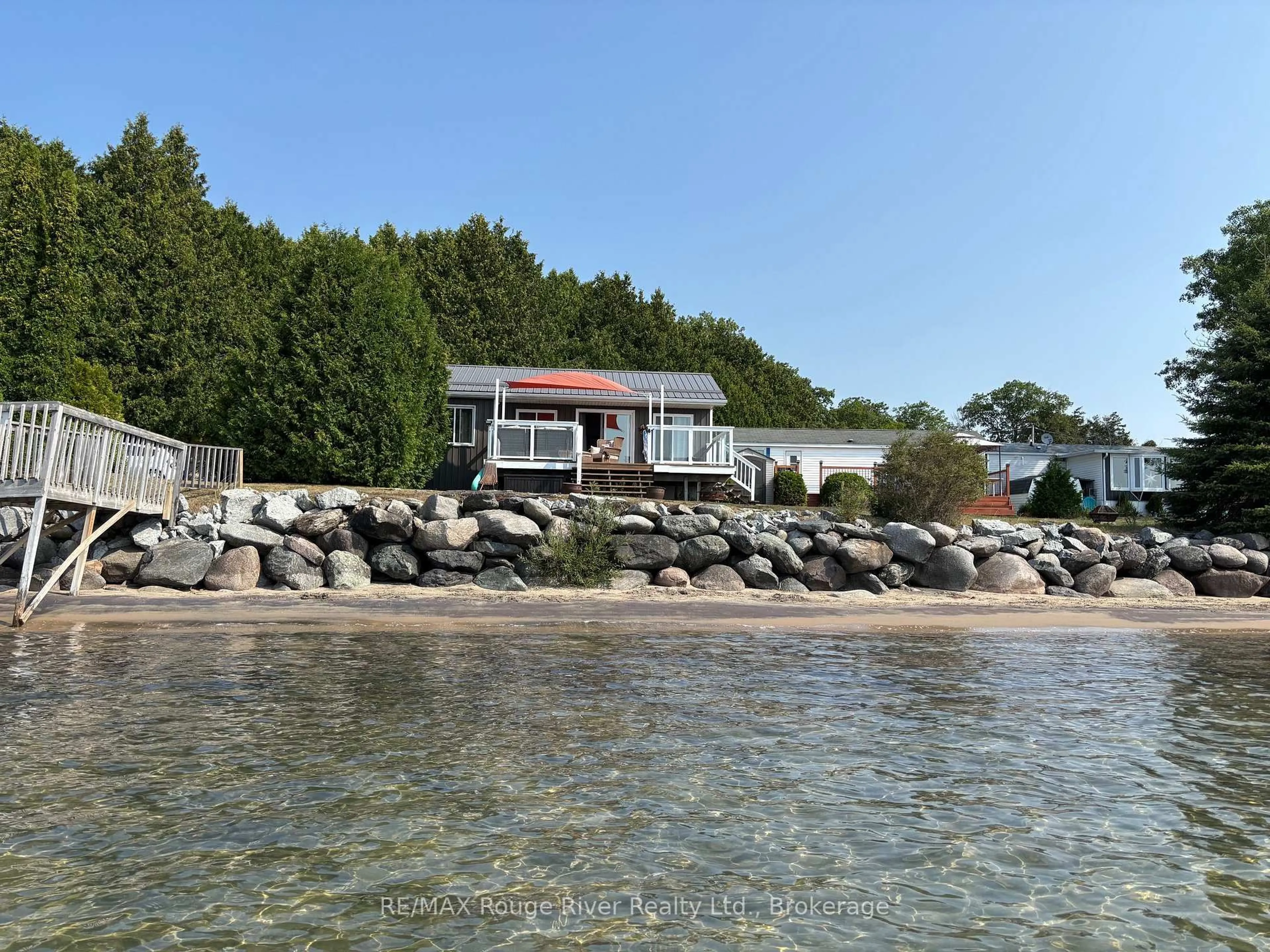 A pic from outside/outdoor area/front of a property/back of a property/a pic from drone, water/lake/river/ocean view for 116 Cedardale Rd #14, Brighton Ontario K0K 1H0