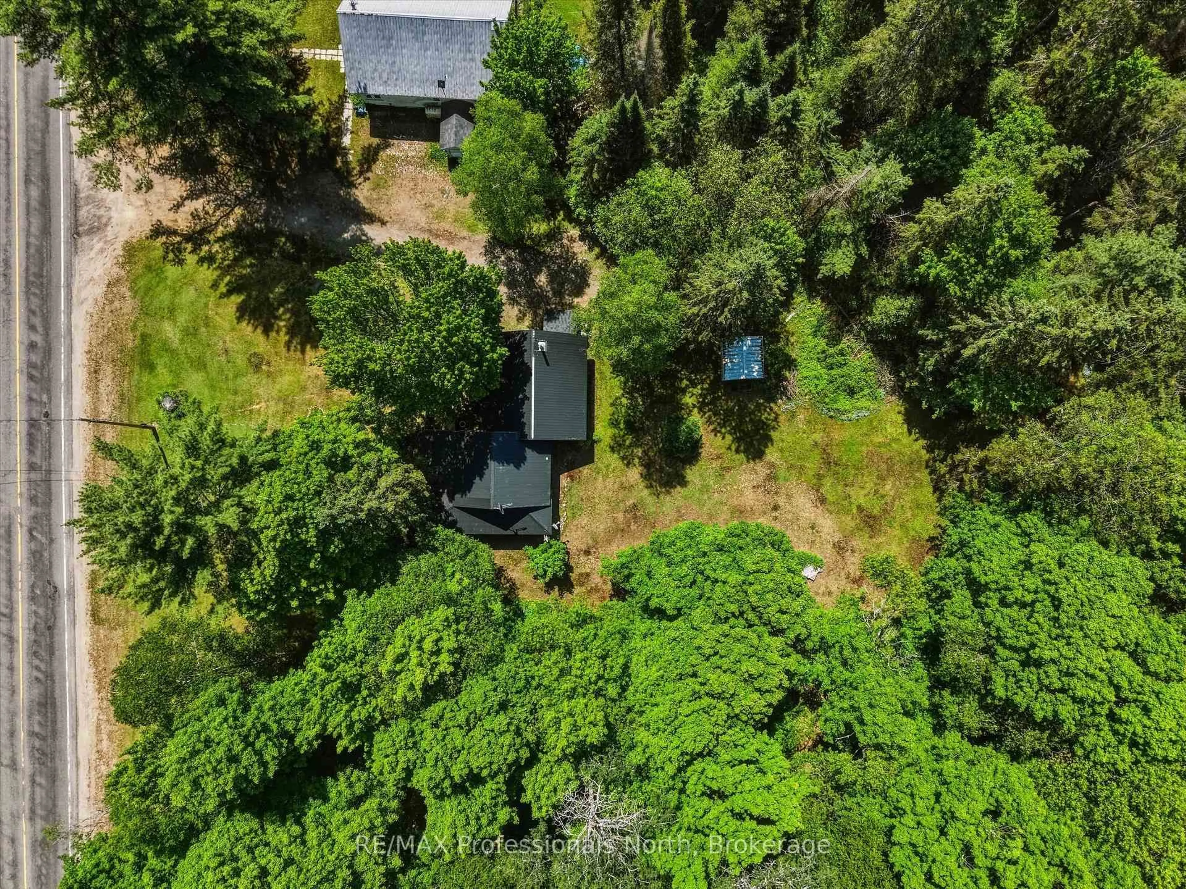 A pic from outside/outdoor area/front of a property/back of a property/a pic from drone, forest/trees view for 950 592 Highway, Perry Ontario P0A 1J0