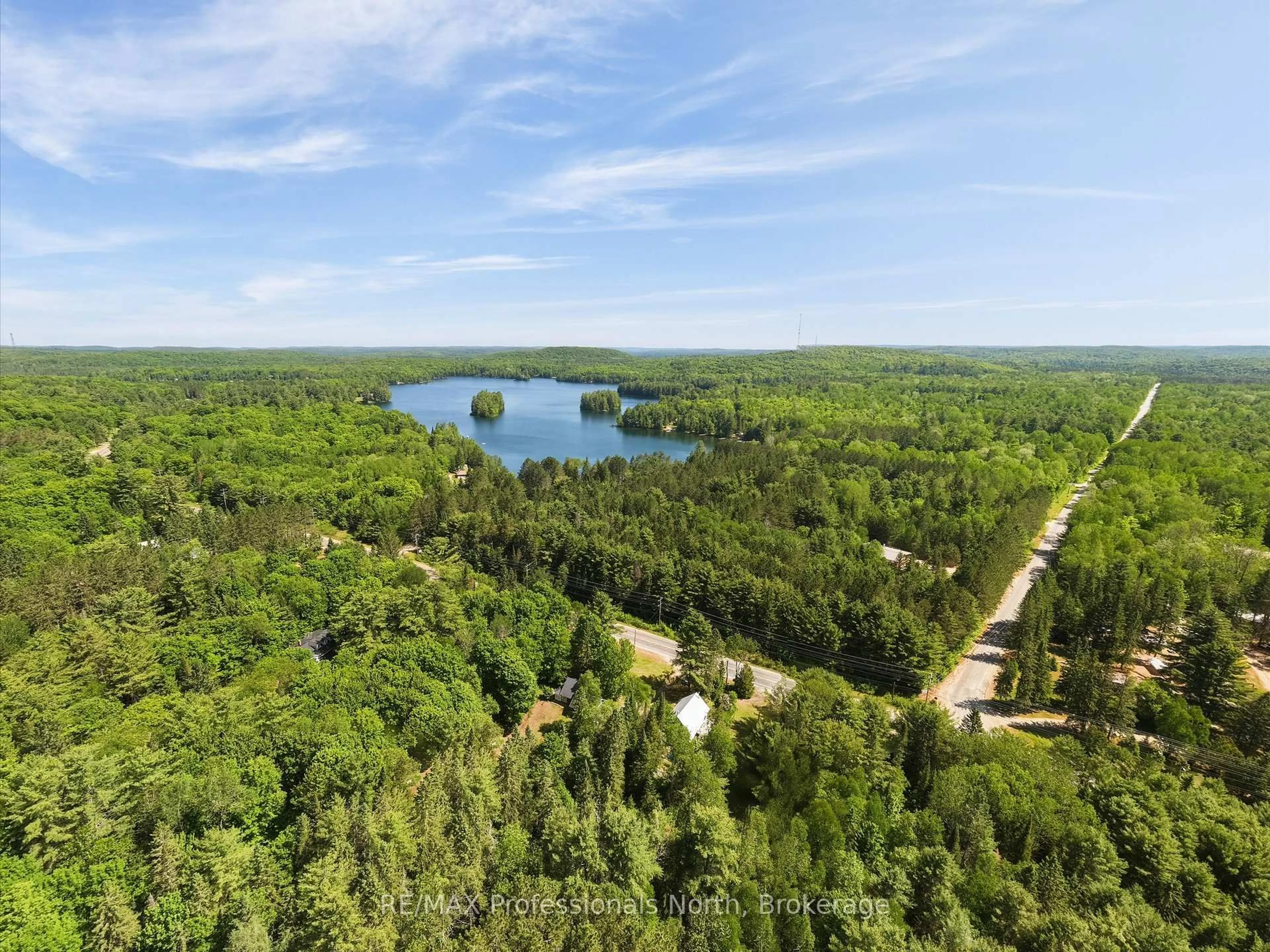 A pic from outside/outdoor area/front of a property/back of a property/a pic from drone, water/lake/river/ocean view for 950 592 Highway, Perry Ontario P0A 1J0
