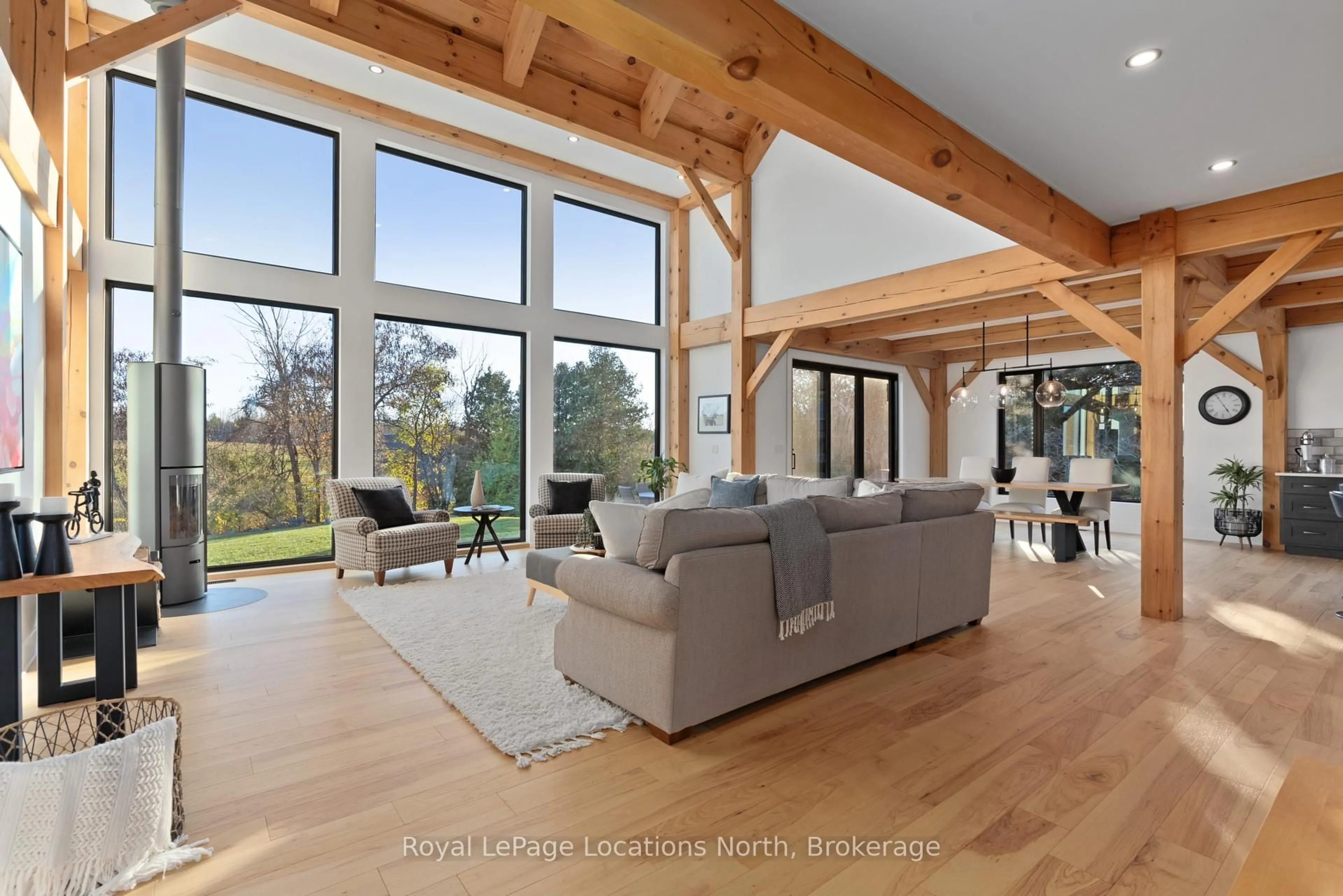 Living room with furniture, wood/laminate floor for 113 Slabtown Rd, Blue Mountains Ontario N0H 1J0