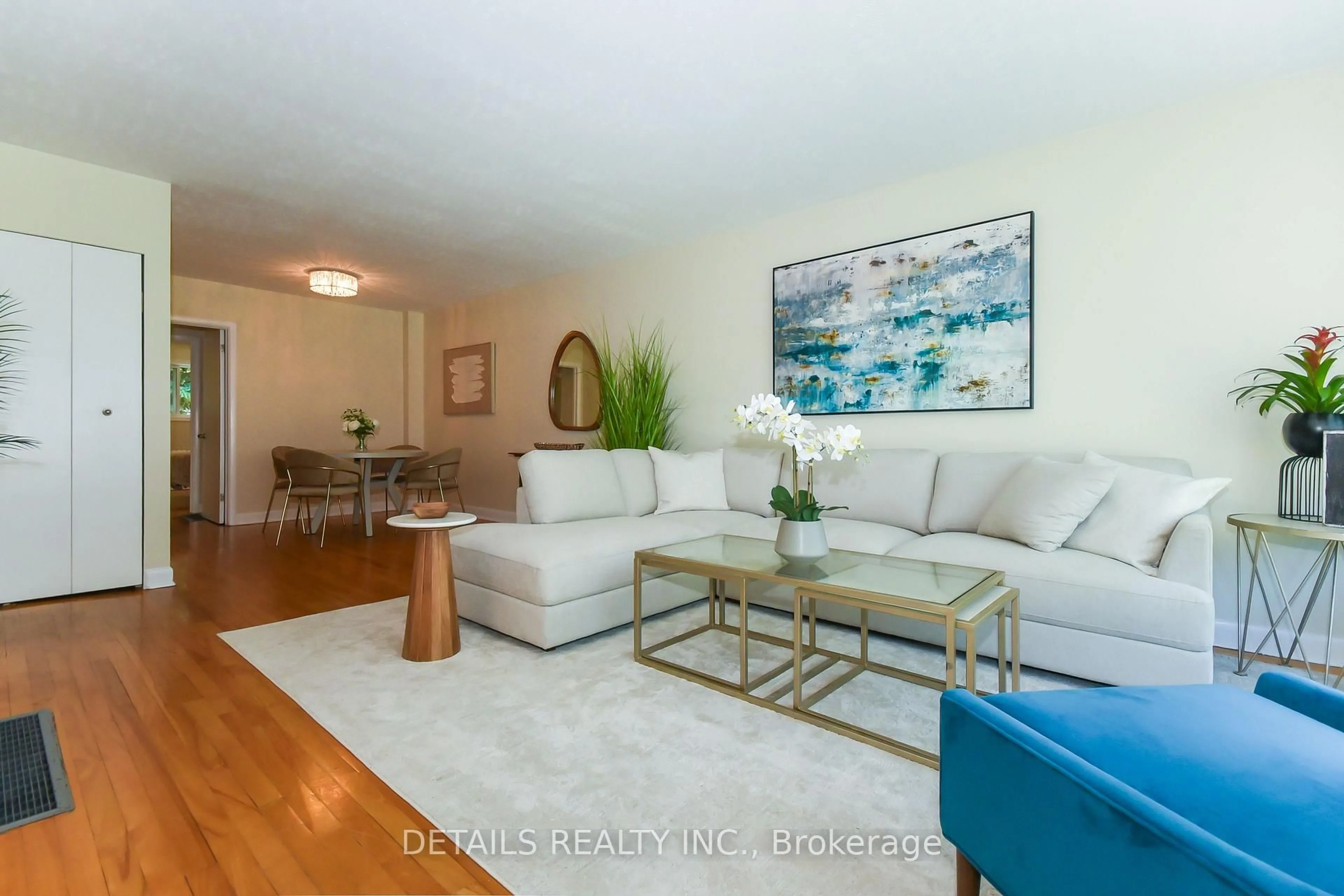 Living room with furniture, wood/laminate floor for 1255 Highgate Rd, Ottawa Ontario K2C 2Y5