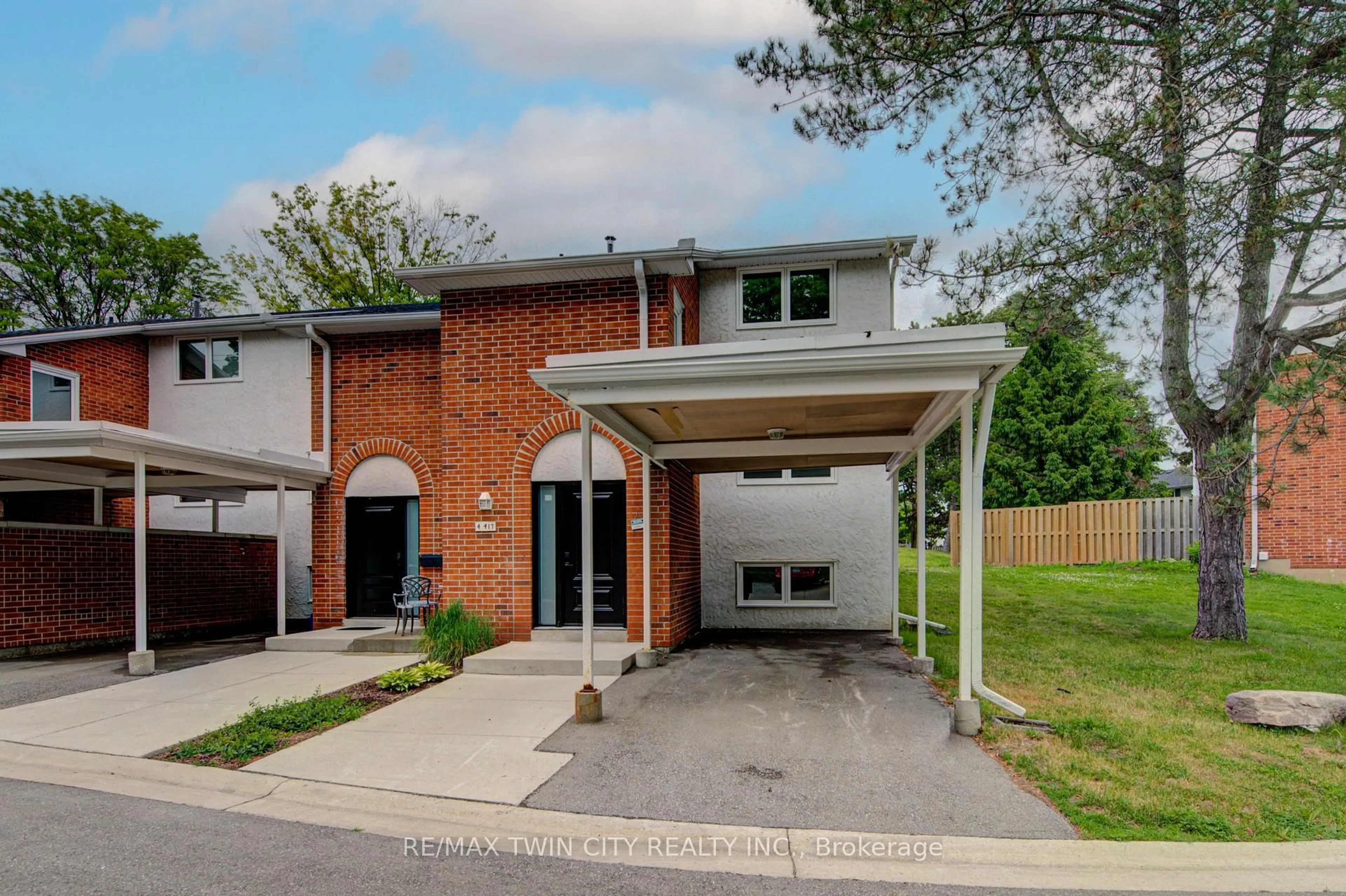 Home with brick exterior material, street for 417 Keats Way #4, Waterloo Ontario N2L 5S7