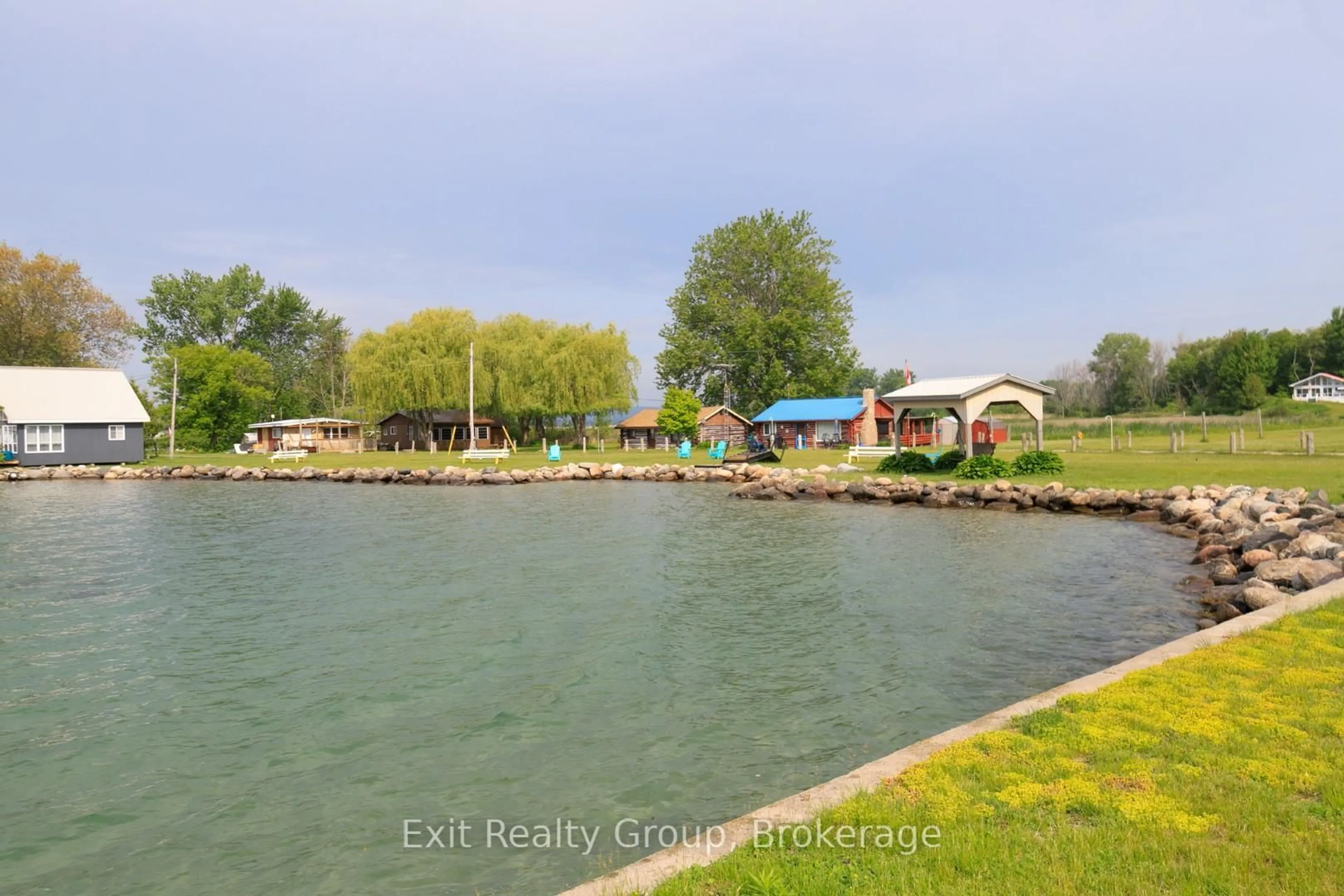 A pic from outside/outdoor area/front of a property/back of a property/a pic from drone, water/lake/river/ocean view for 87 Evergreen Lane, Brighton Ontario K0K 1L0