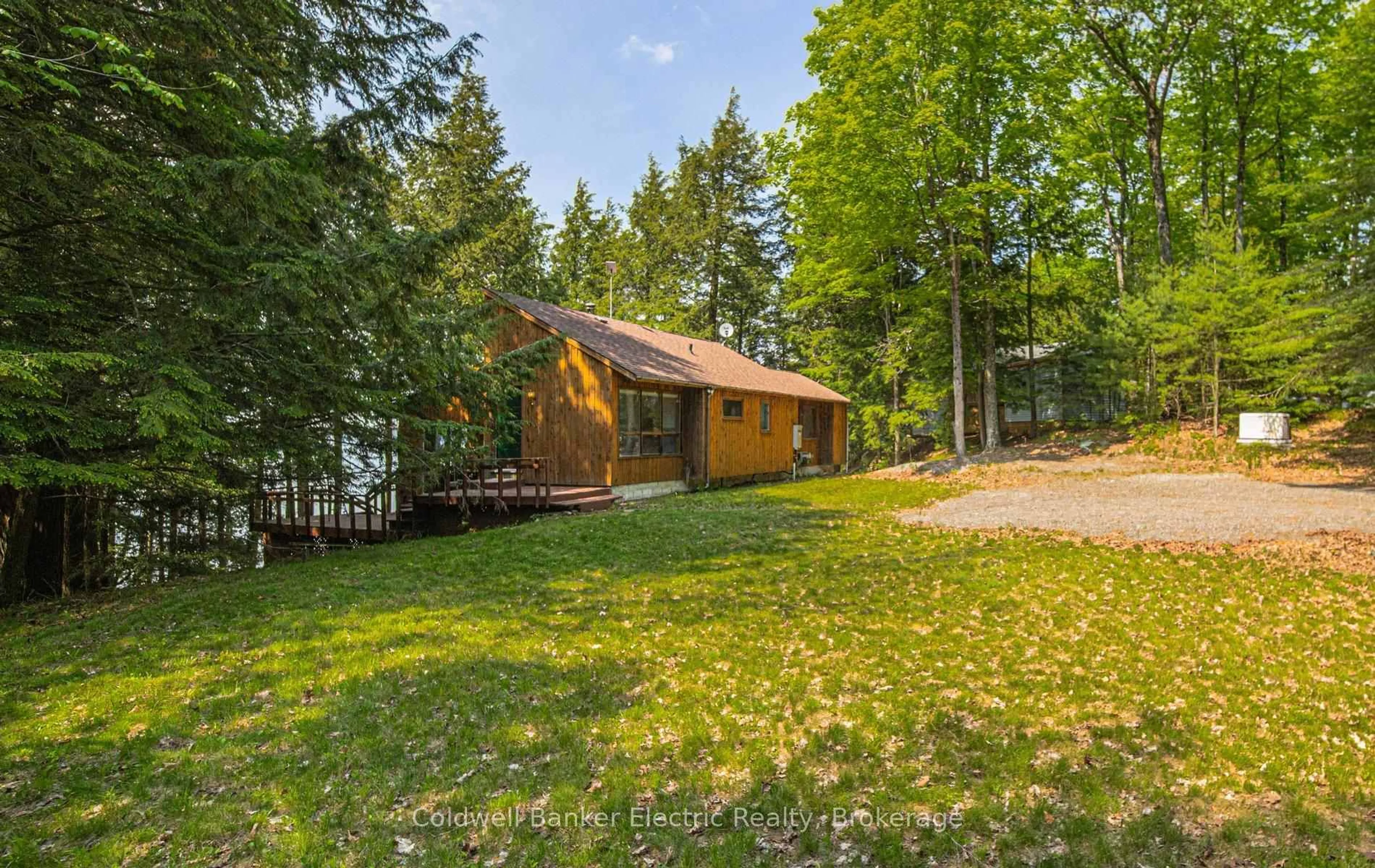 A pic from outside/outdoor area/front of a property/back of a property/a pic from drone, forest/trees view for 555 Fire Route 50, North Kawartha Ontario K0L 1A0