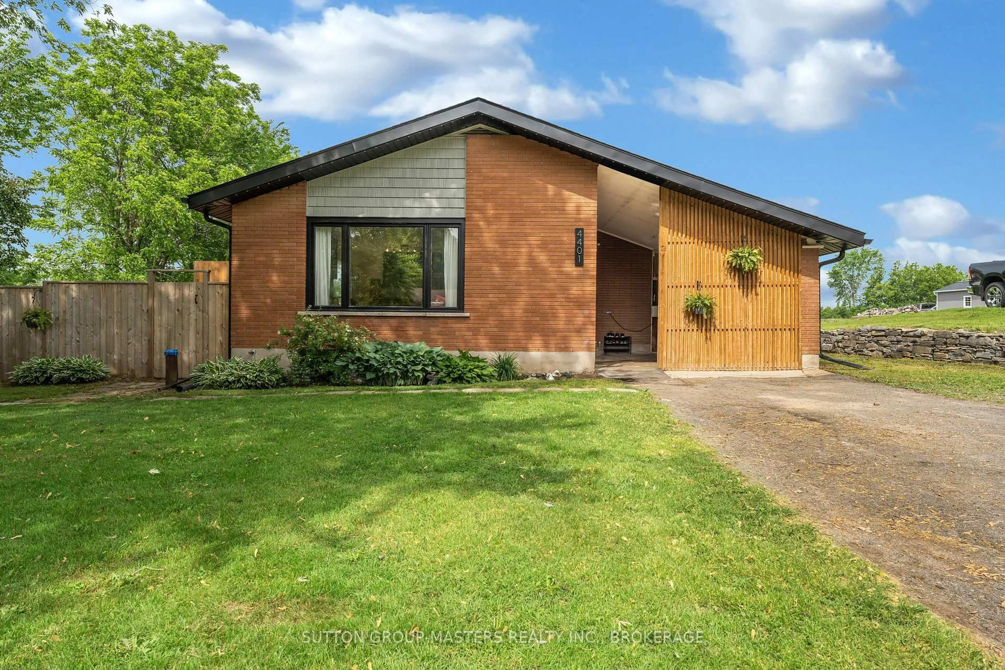 Home with brick exterior material, street for 4401 Notre Dame St, Harrowsmith Ontario K0H 1V0
