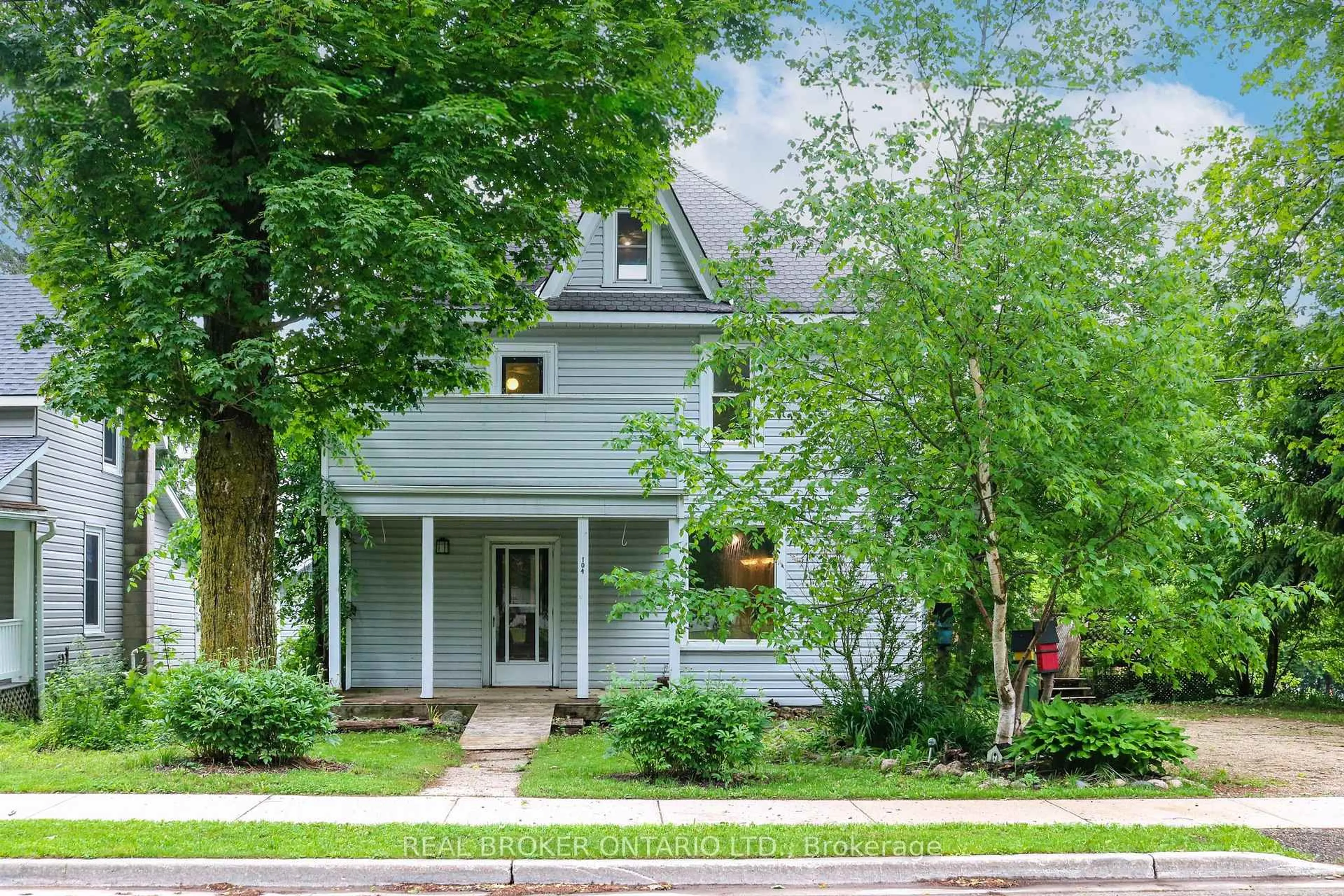 Home with vinyl exterior material, street for 104 Isla St, Grey Highlands Ontario N0C 1H0
