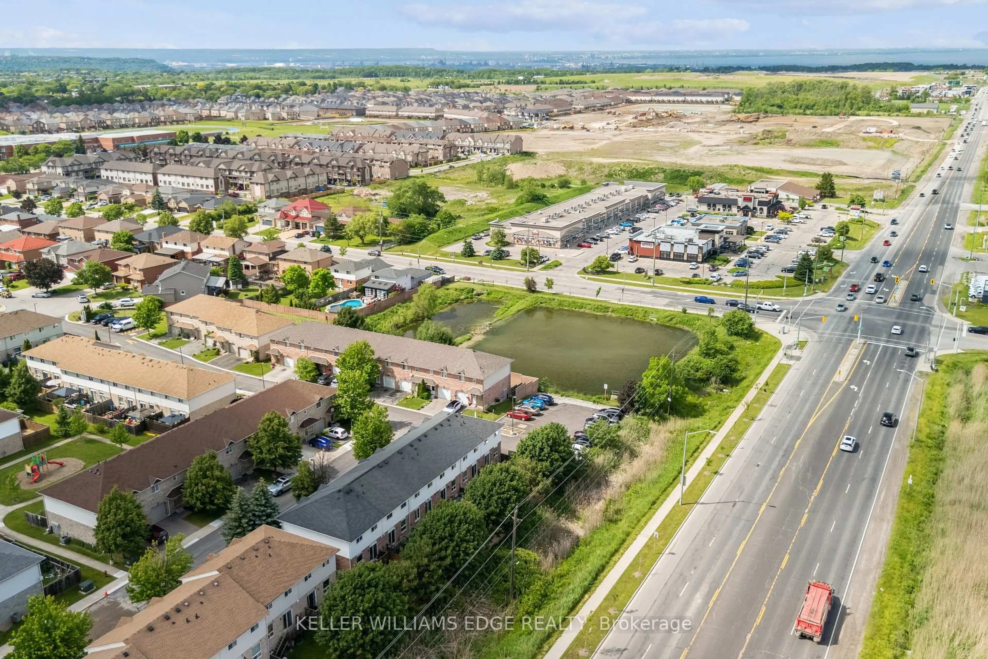 A pic from outside/outdoor area/front of a property/back of a property/a pic from drone, street for 39 Pinewoods Dr #35, Hamilton Ontario L8J 3Z4