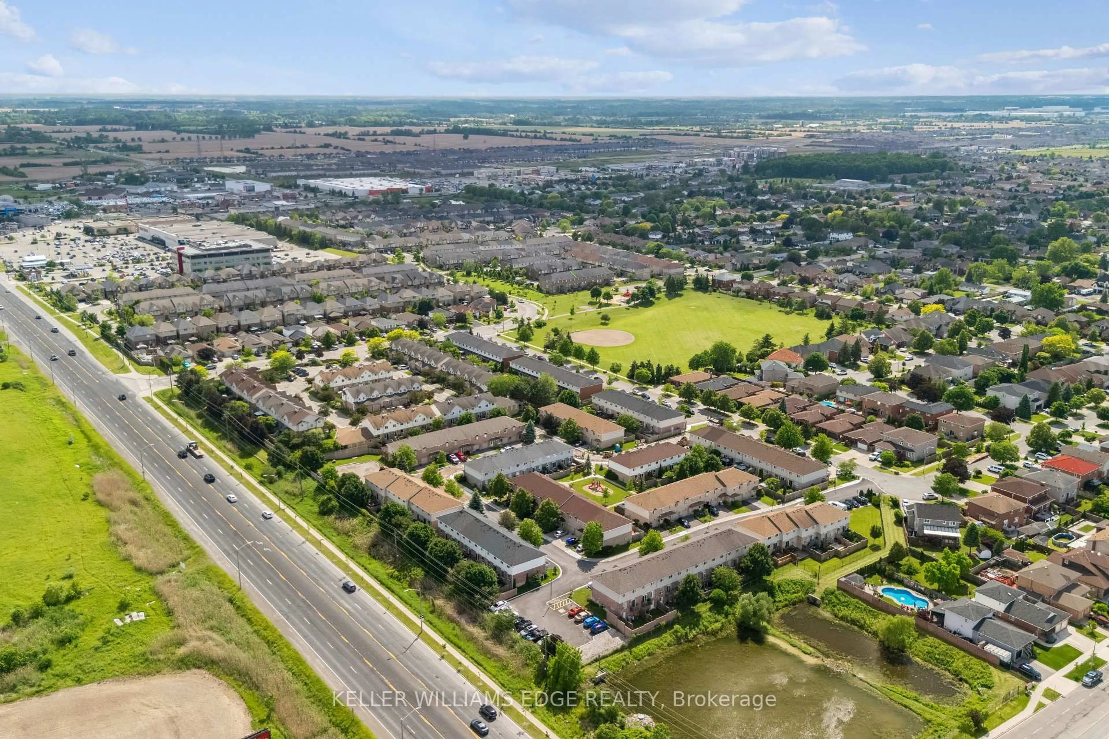 A pic from outside/outdoor area/front of a property/back of a property/a pic from drone, street for 39 Pinewoods Dr #35, Hamilton Ontario L8J 3Z4