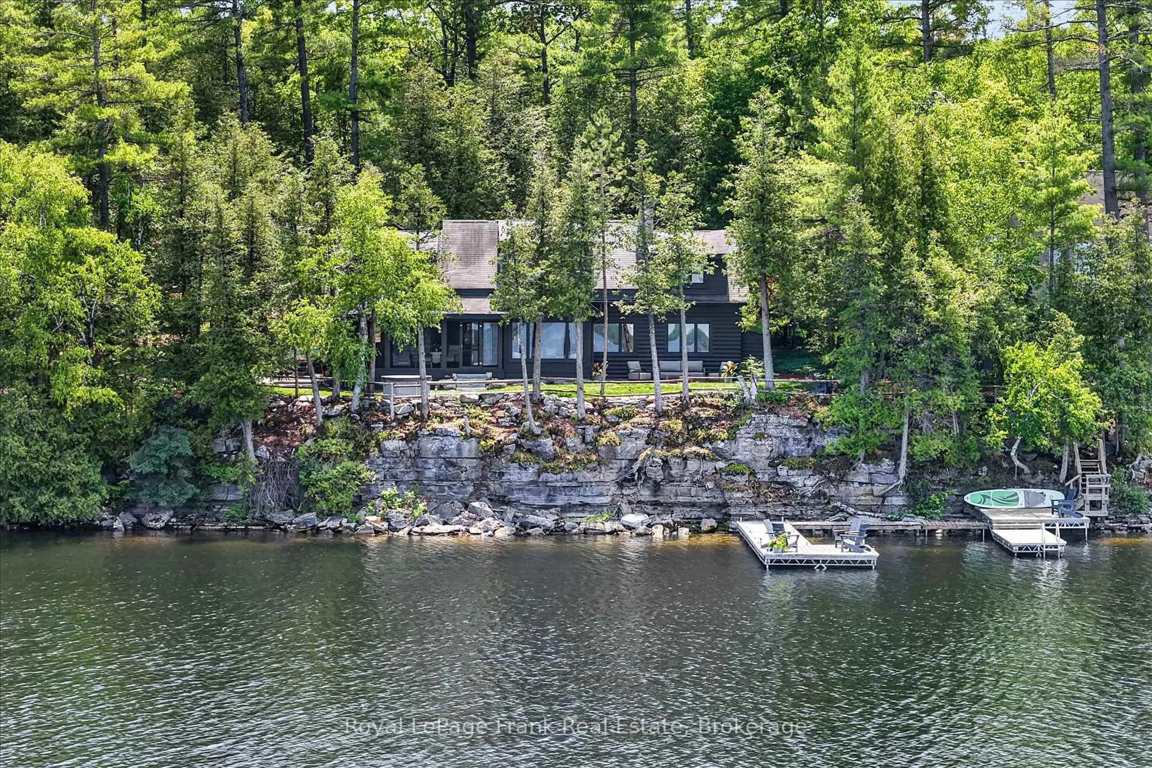 A pic from outside/outdoor area/front of a property/back of a property/a pic from drone, water/lake/river/ocean view for 1973 Fiddlers Lane, Douro-Dummer Ontario K0L 2H0