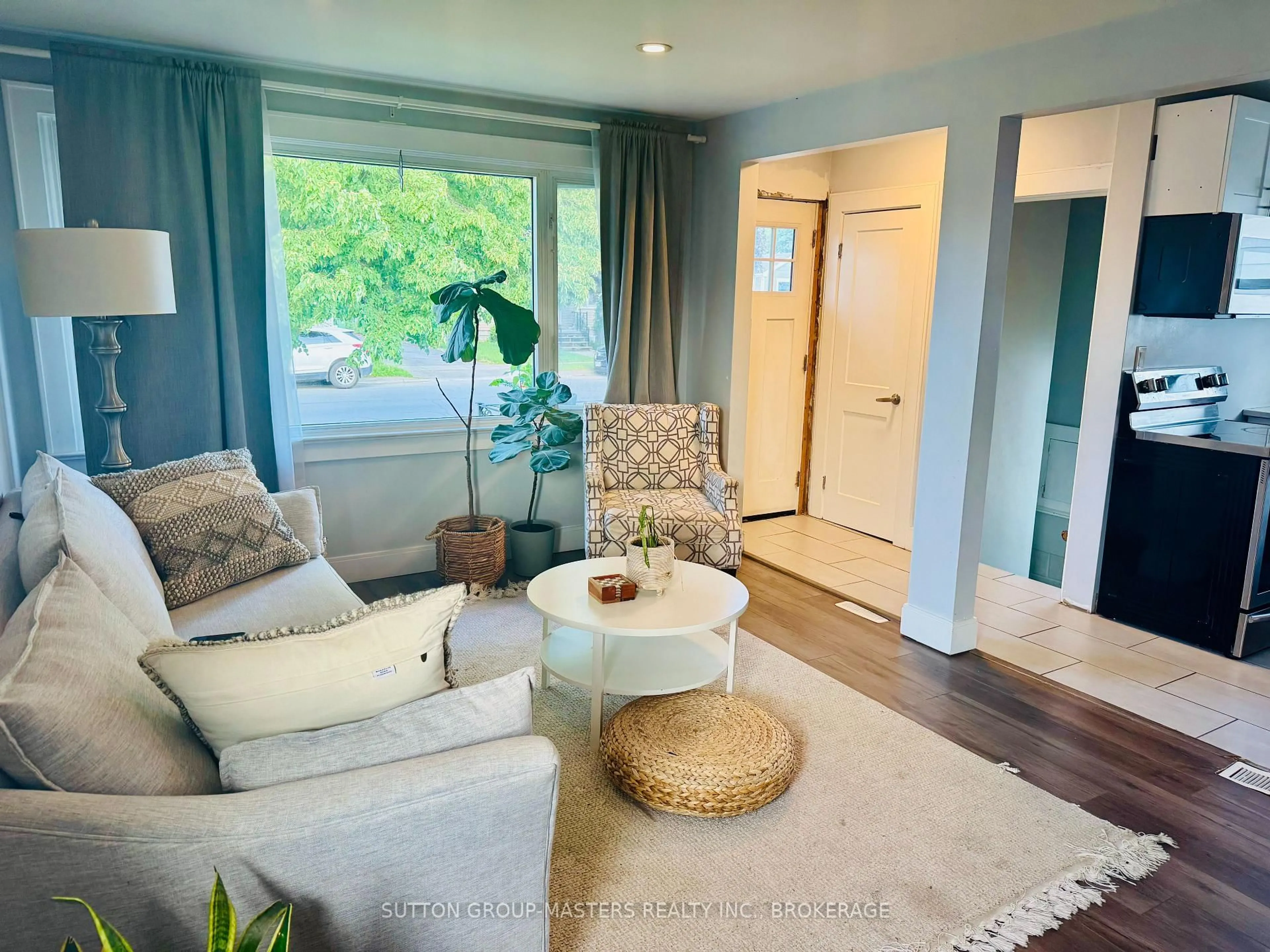 Living room with furniture, wood/laminate floor for 808 Victoria St, Kingston Ontario K7K 4T3