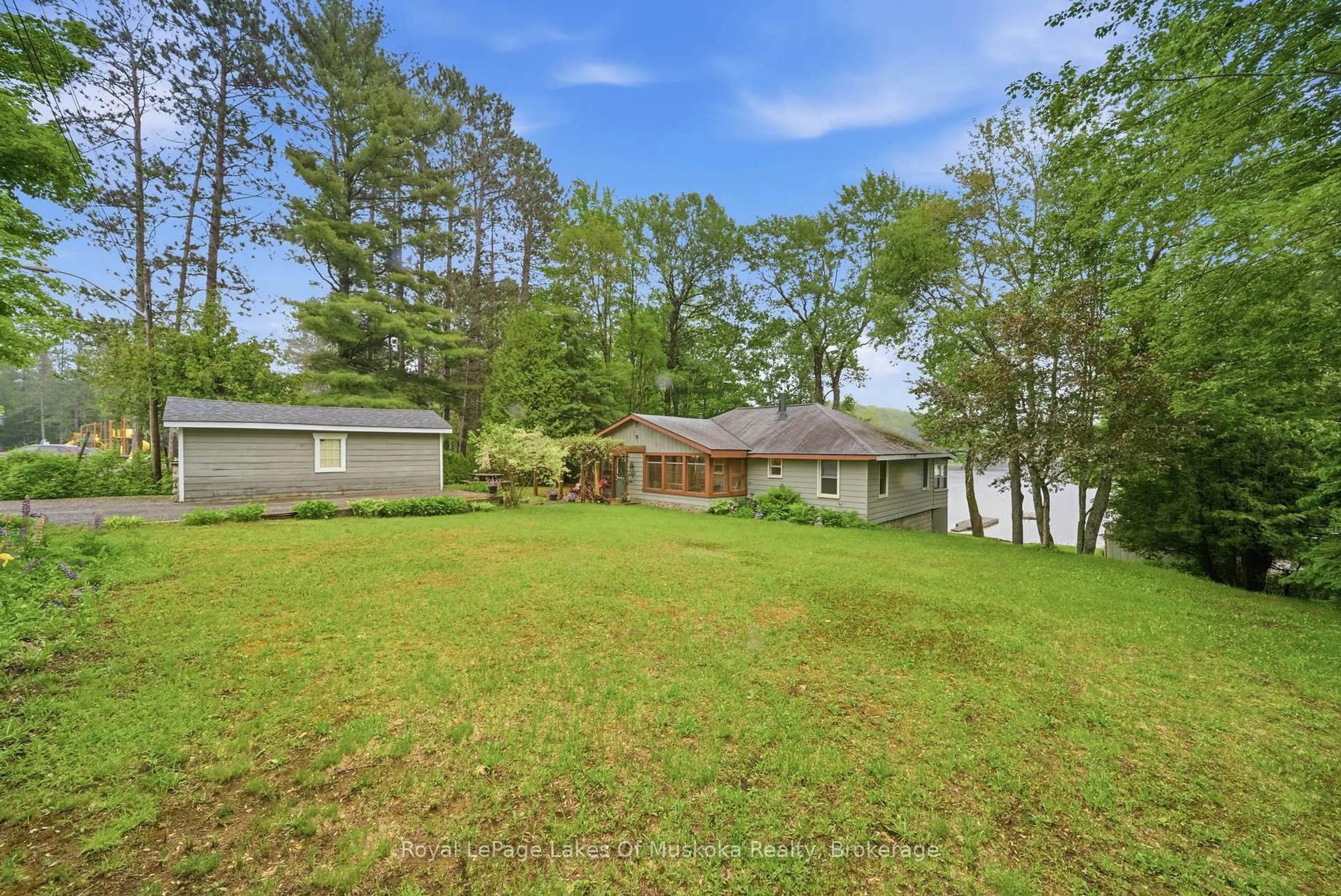A pic from outside/outdoor area/front of a property/back of a property/a pic from drone, water/lake/river/ocean view for 11 Carol St, Lake of Bays Ontario P0B 1A0