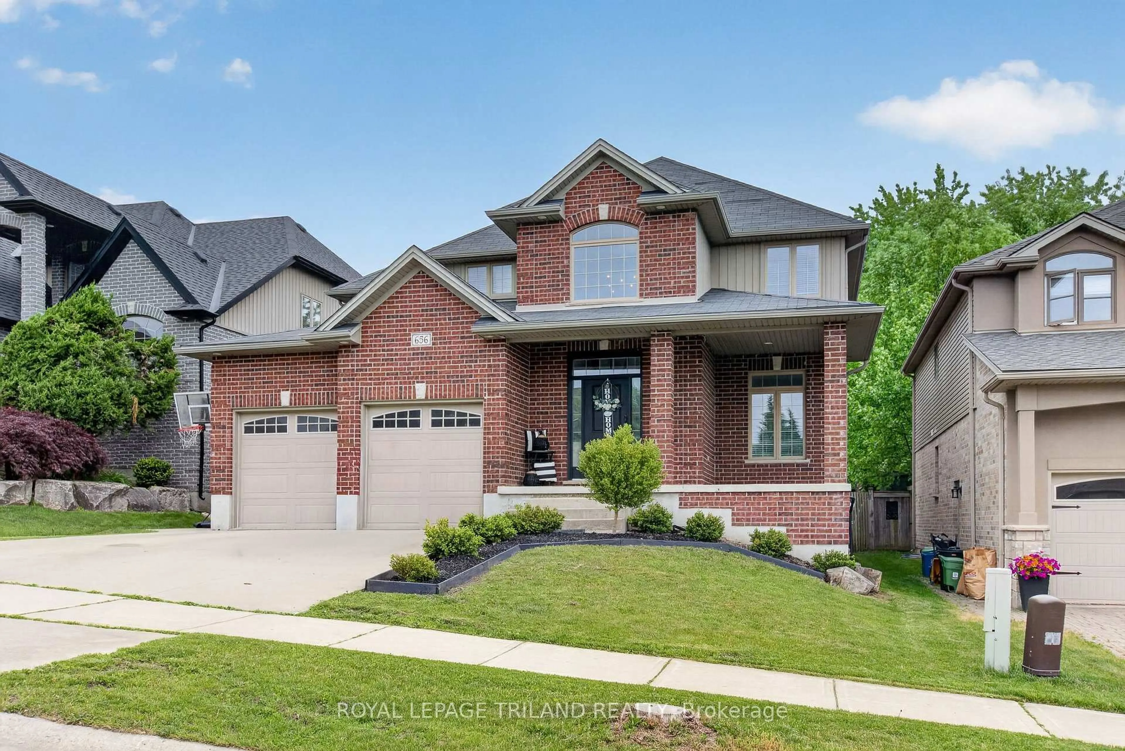 Home with brick exterior material, street for 656 Redtail Tr, London North Ontario N6H 5X7