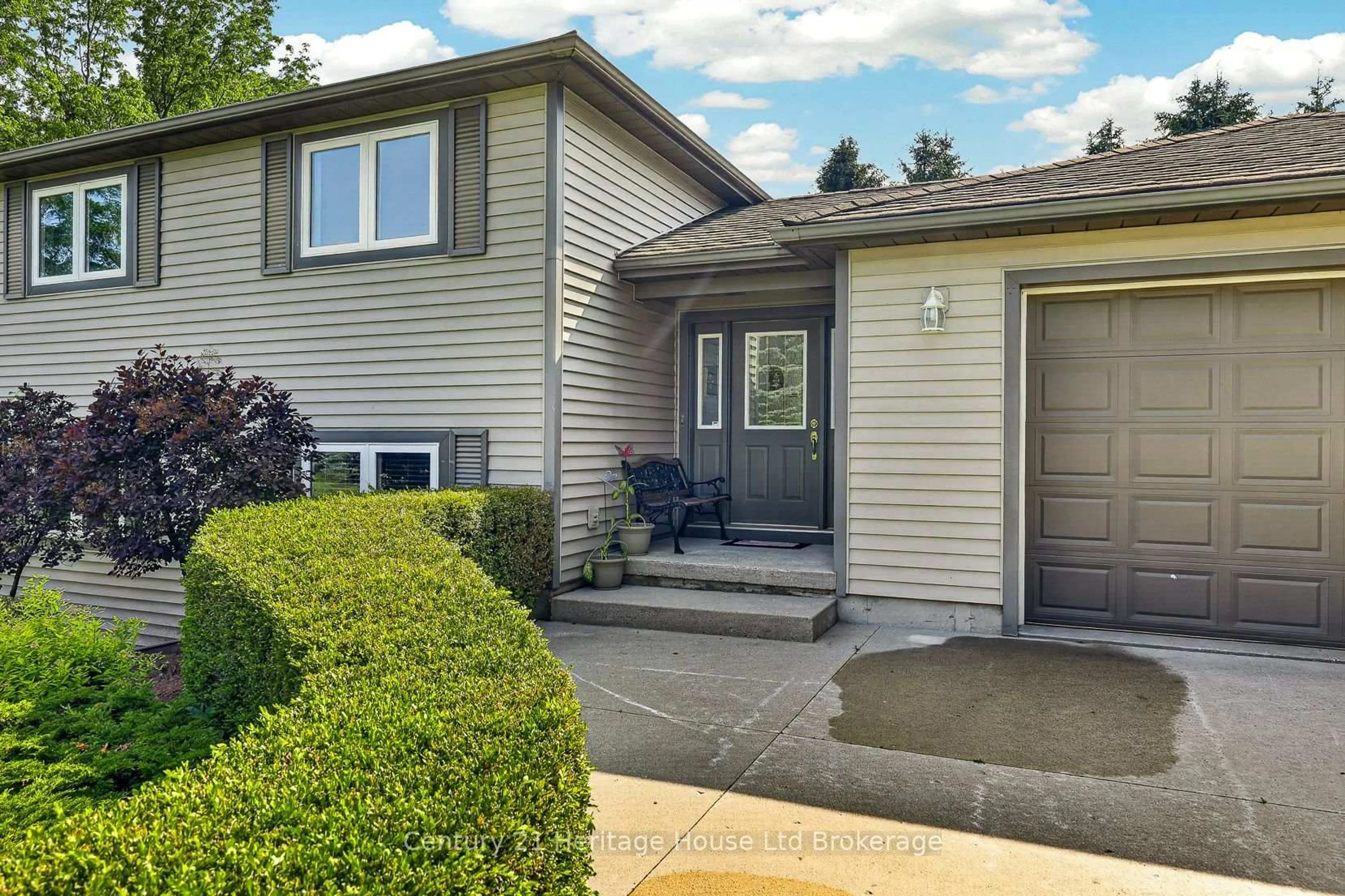 Home with vinyl exterior material, street for 1567 Forestry Farm Rd, Norfolk Ontario N0G 1G0