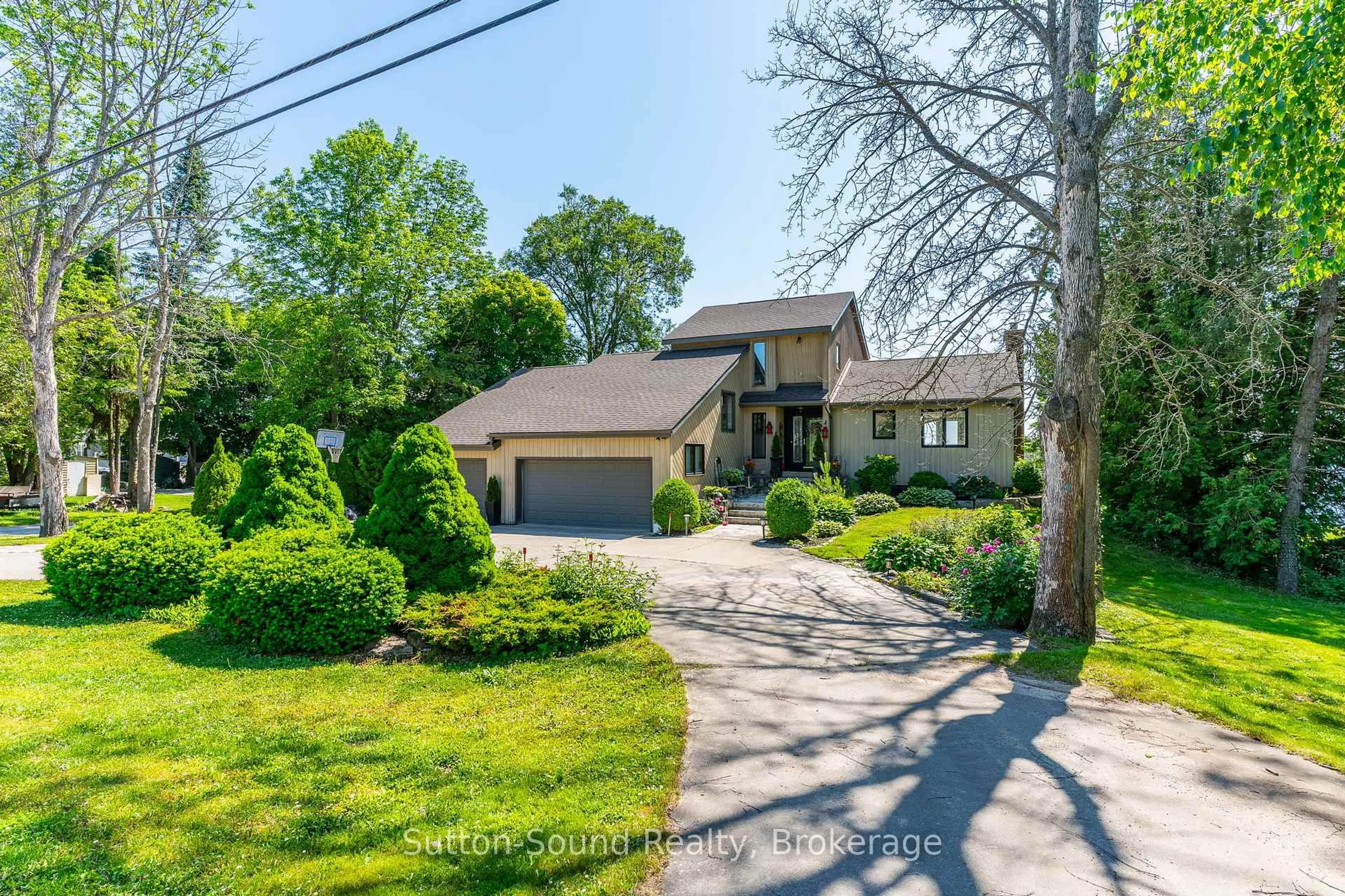 A pic from outside/outdoor area/front of a property/back of a property/a pic from drone, street for 427 Balmy Beach Rd, Georgian Bluffs Ontario N4K 5N4
